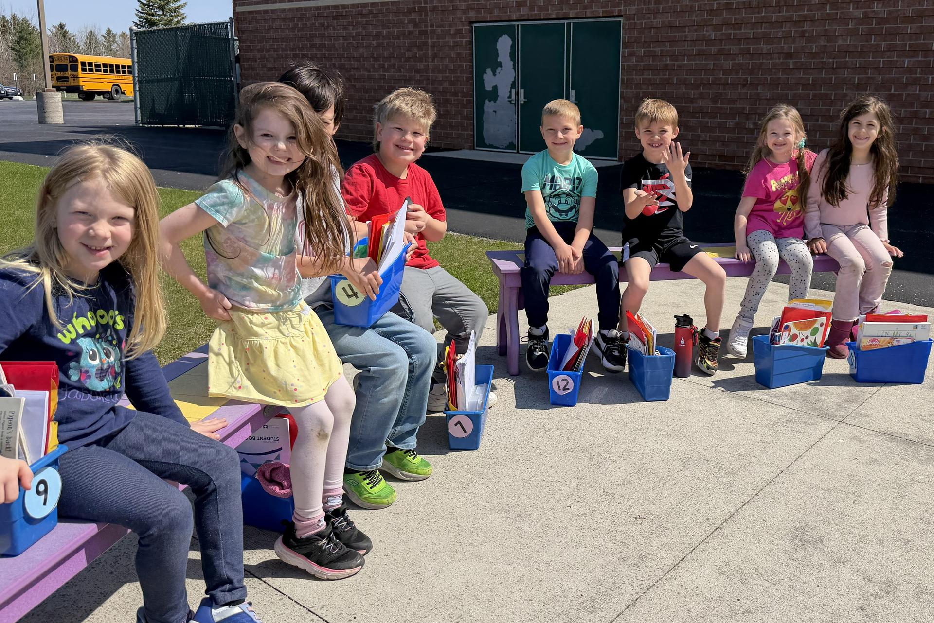 Elementary School students reading outside