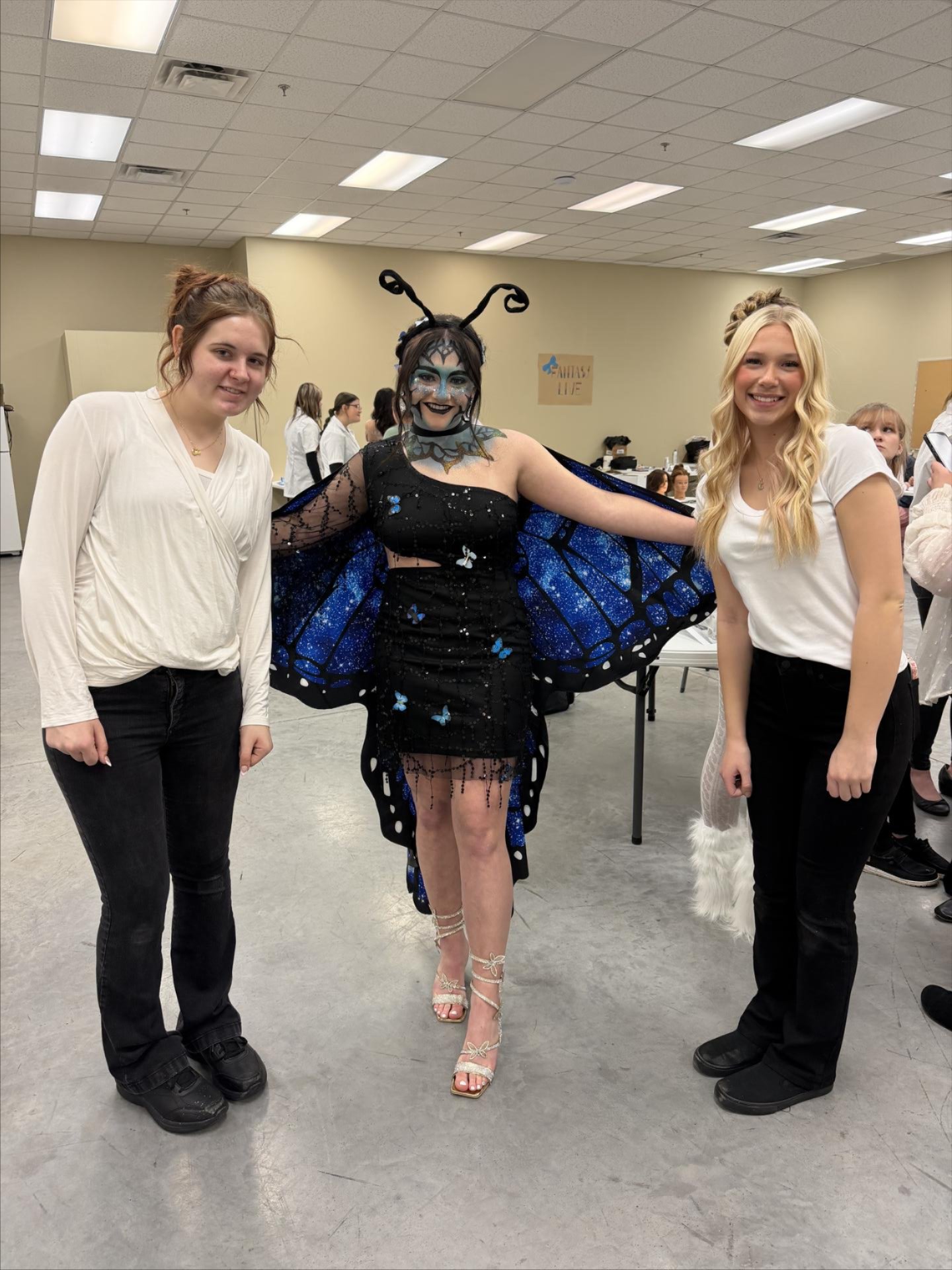 Cosmetology students pose for a picture.