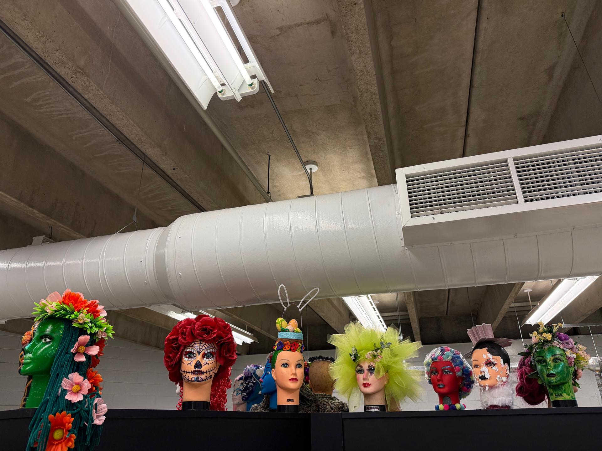 A favorite hands-on activity among students is the “Anything But Hair” project, where they use mannequin heads to showcase creativity in unique and artistic ways.