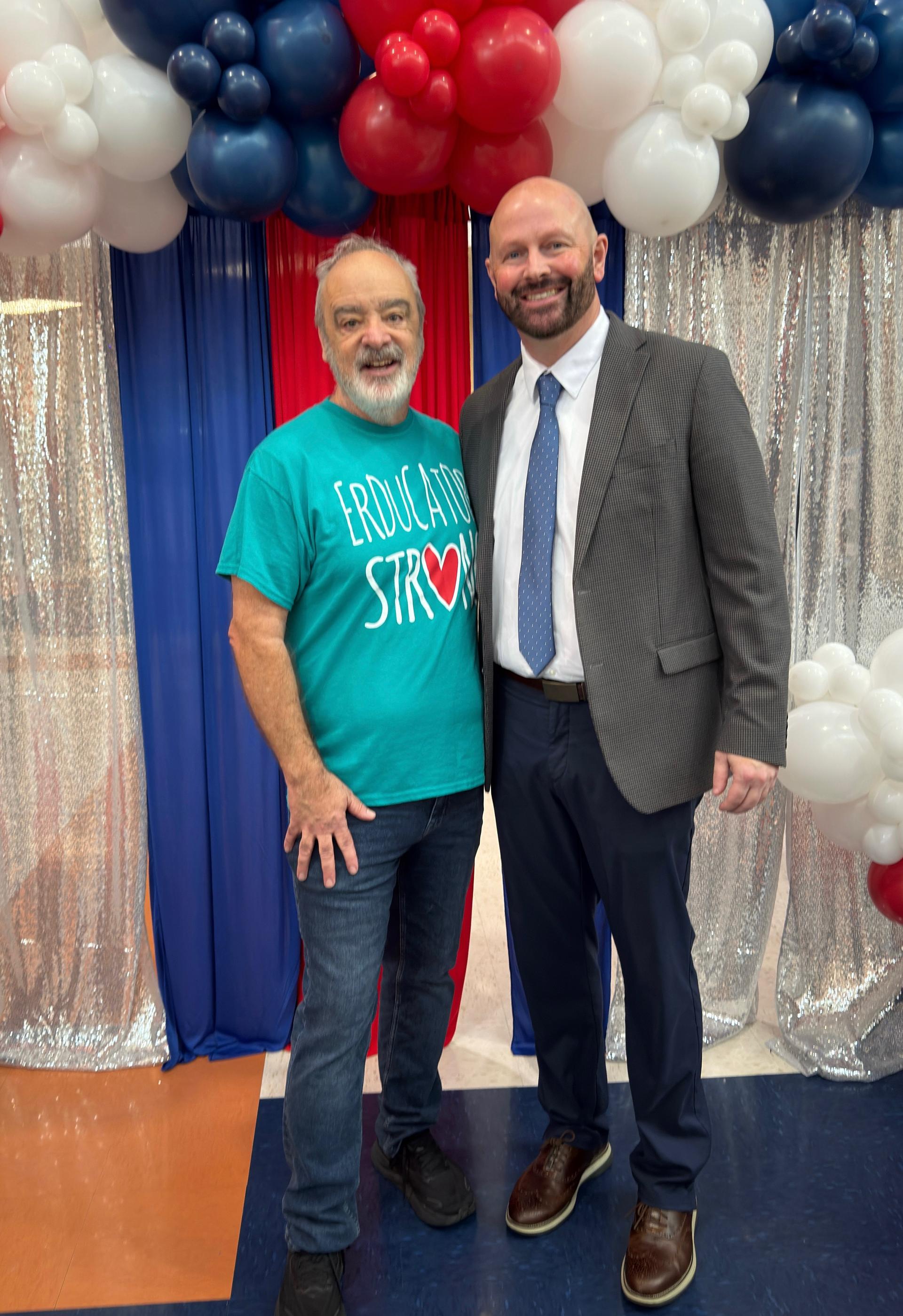 Mr. Gerry Brooks stands with Superintendent, Dr. Mike Goforth