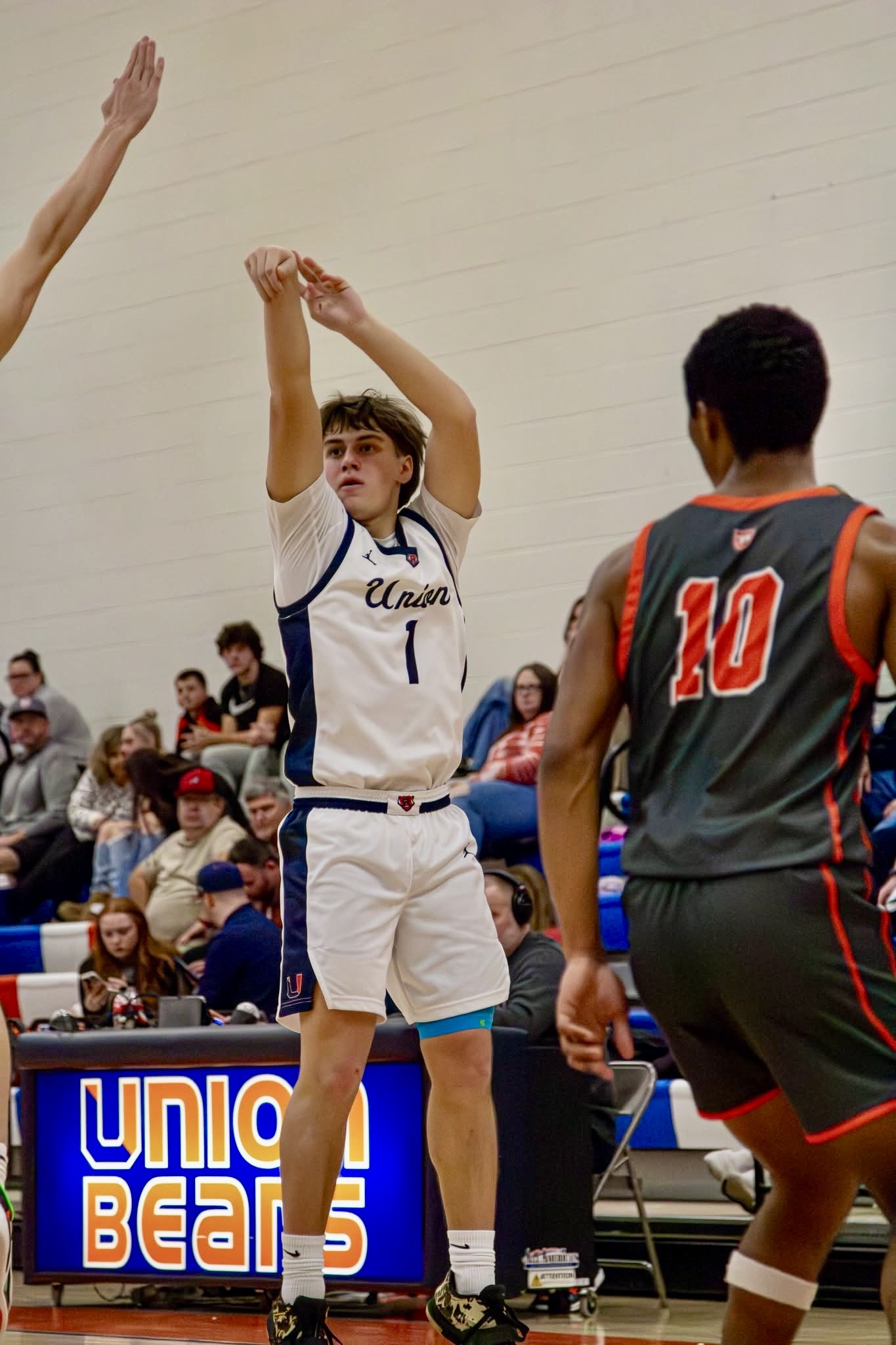 Union High School player shoots a jump shot