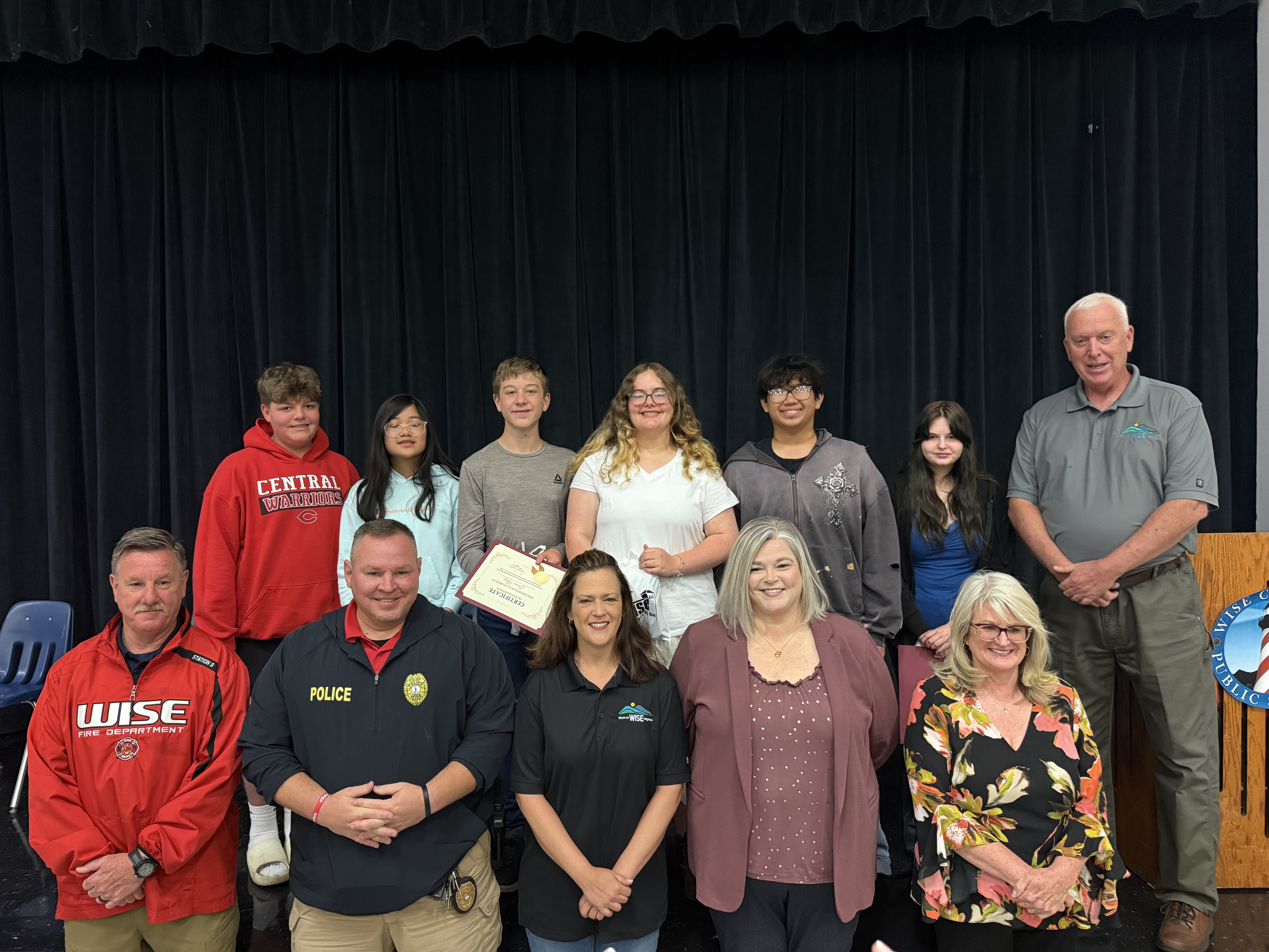 Seventh and eighth grade essay contest winners pose for a picture with the Town of Wise Directors and Mayor.