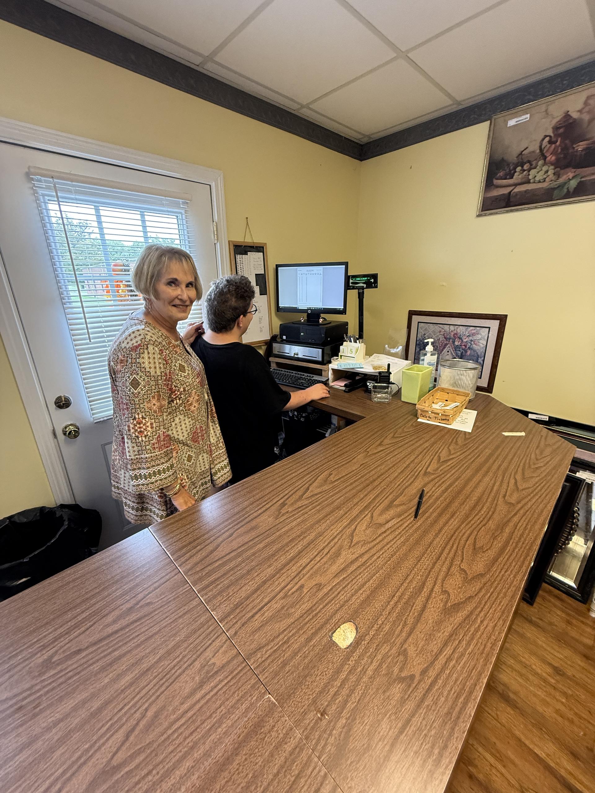 A student checks out a customer