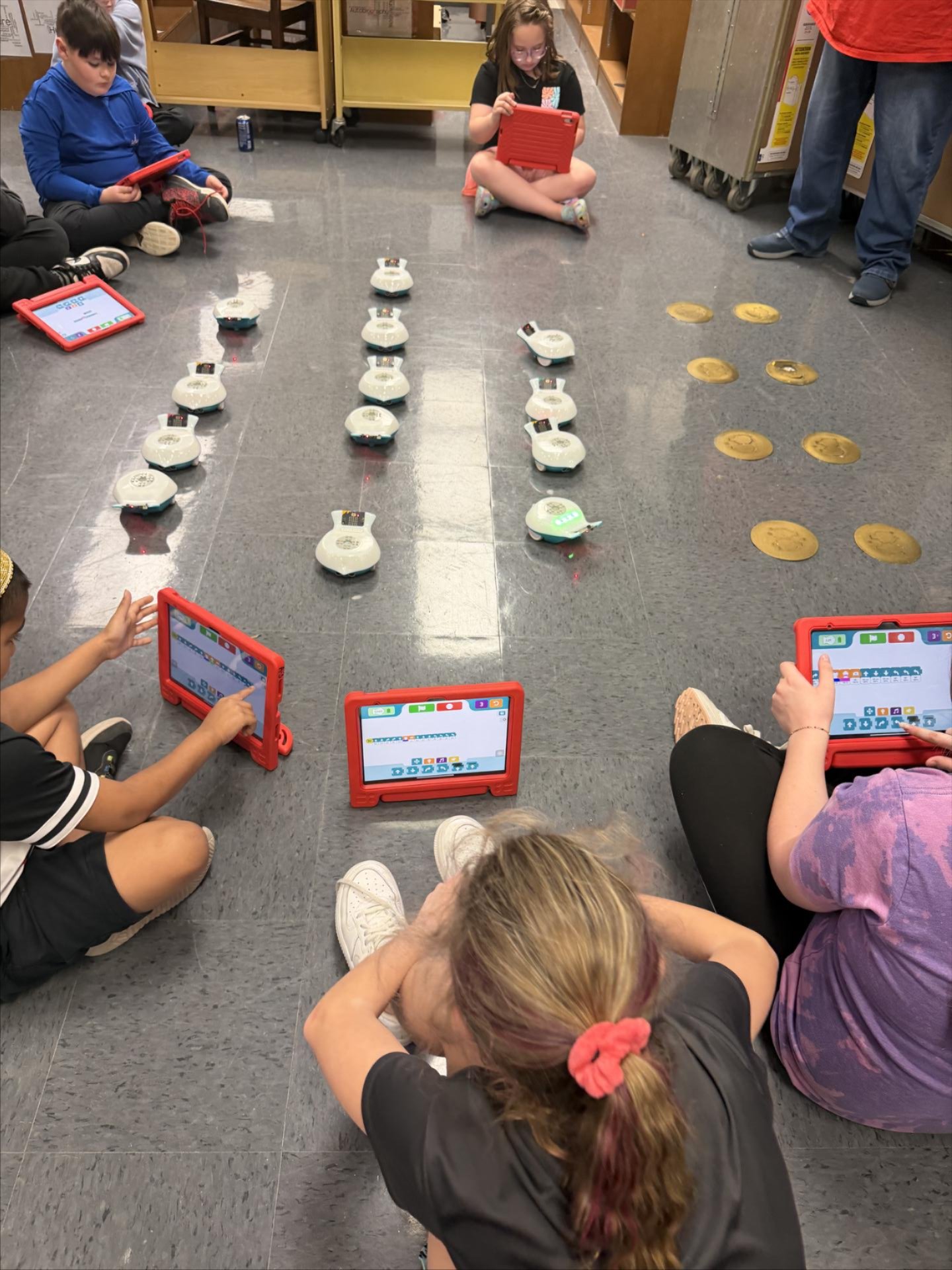 On March 30, 2026, Heather Askea and two UVA-Wise Streamwise student ambassadors visited JW Adams Robotics to teach students new and fun technology. Students had the opportunity to use the Spherios in a new way- with a number line activity, and were introduced to an exciting new way to code using the Finch robots. Students had fun learning how to code the finches and letting them travel around the library. A fun activity was trying to get the club sponsors, Ms. Karen, Ms. Ruth, Mrs. Bolling, and Mrs. Miller, with the finches. The final activity of the Streamwise visit was a coordinated dance using the finches. At the end of the visit, Mrs. Askea asked students what their favorite activity of the day was, and the overwhelming response was 