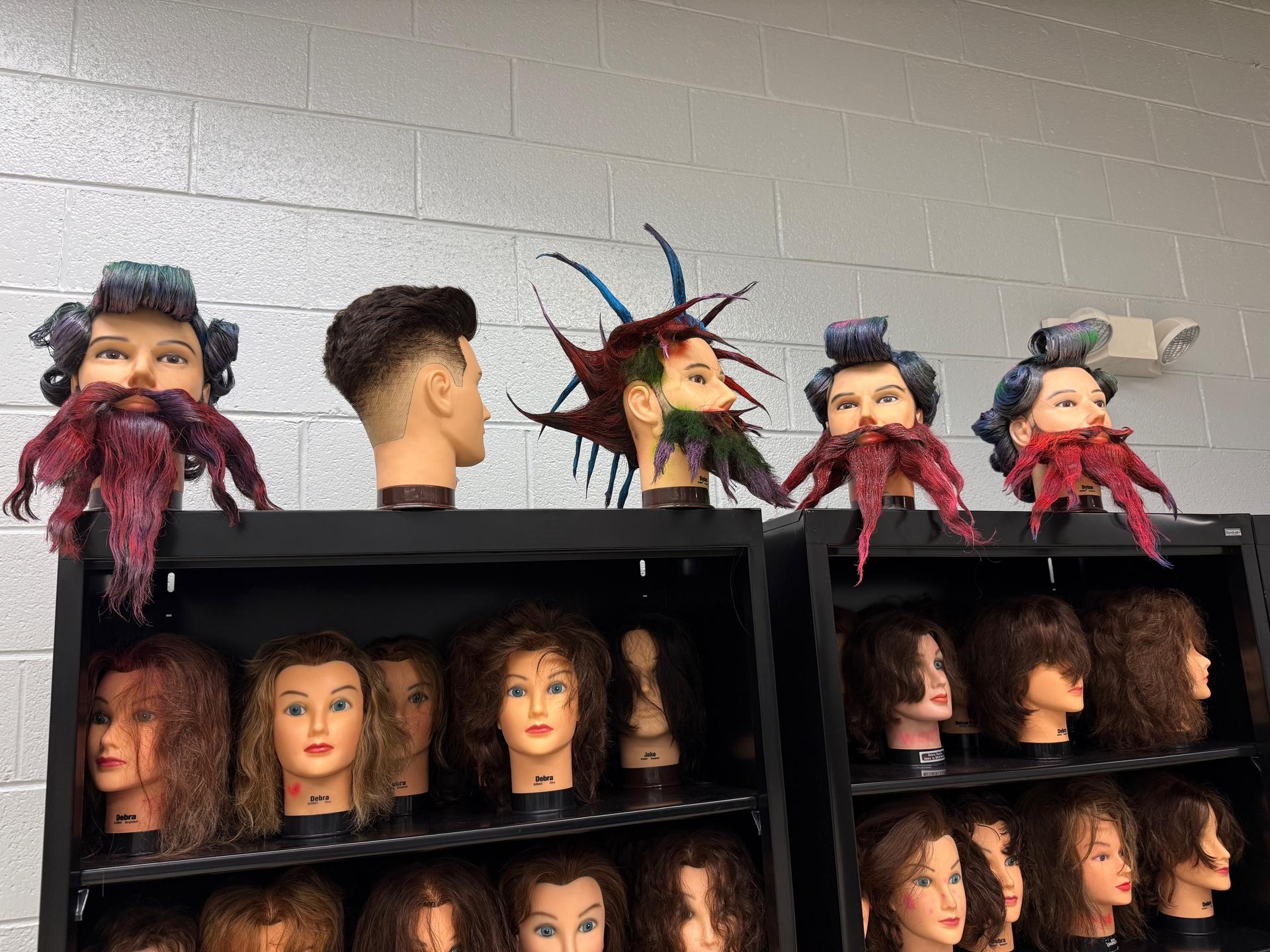 A favorite hands-on activity among students is the “Anything But Hair” project, where they use mannequin heads to showcase creativity in unique and artistic ways.