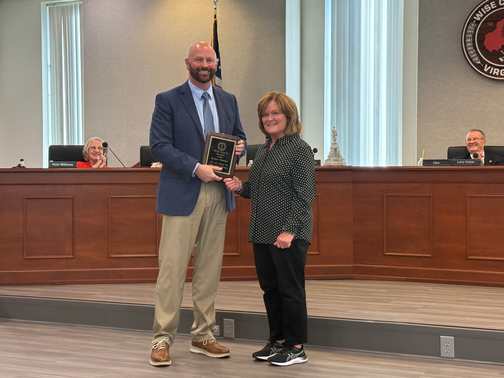 Dr. Mike Goforth presents a retirement plaque to Mrs. Karen Dotson | 43 Years of Service