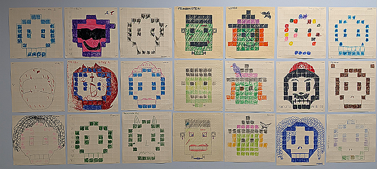  Student created art work displayed on the Bryant Hall wall. The pieces show different renditions of Skulls, Witches, and Frankenstein's Monster. 