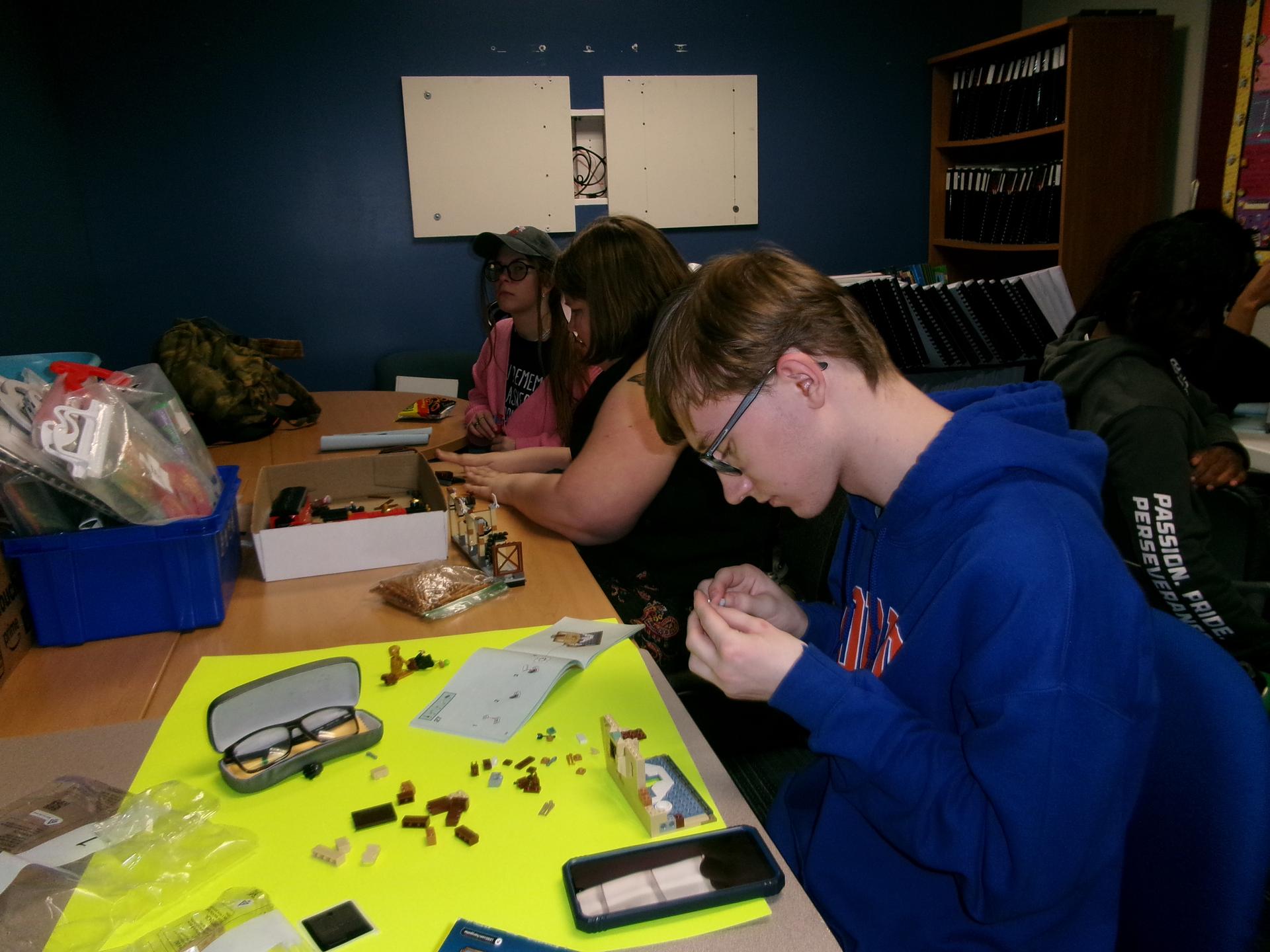 Ethan holding small Lego pieces