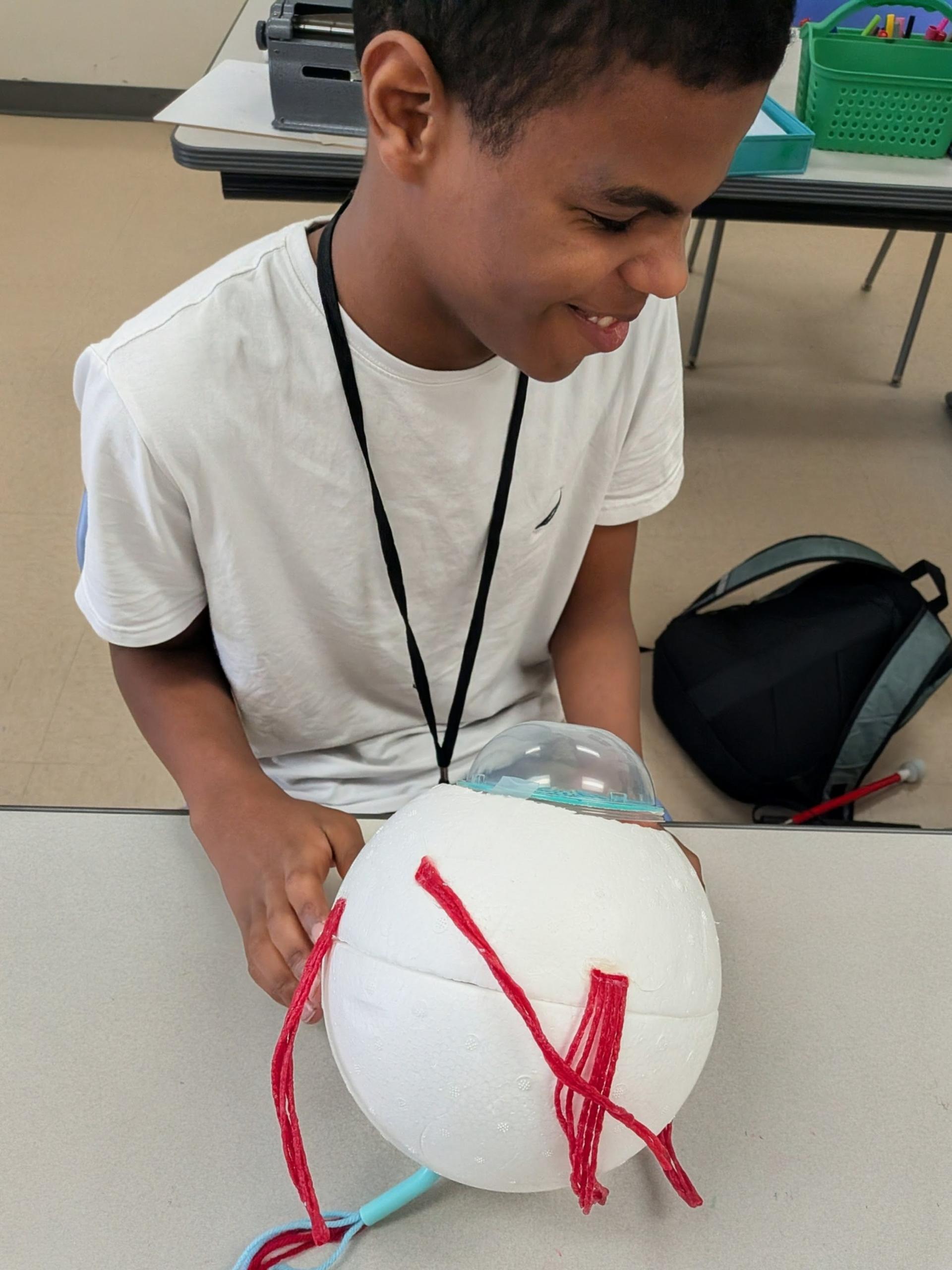 Juniell feels the outside of the replica