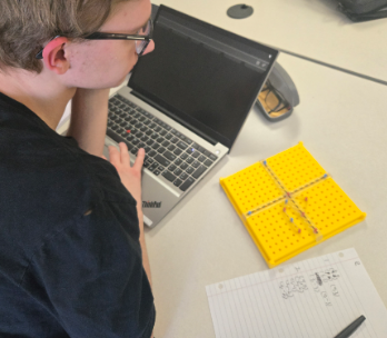 Ethan Jones has finished graphing and writing his second image. He has made a lower case 