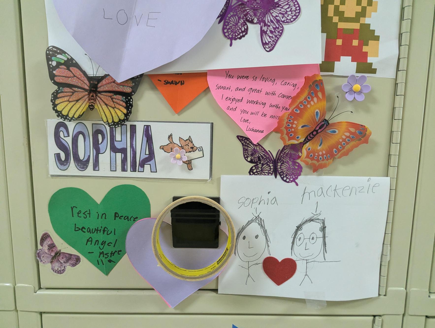 closeup of a portion of Sophia's locker showing her personalized name tag, butterflies, and drawings and words from friends