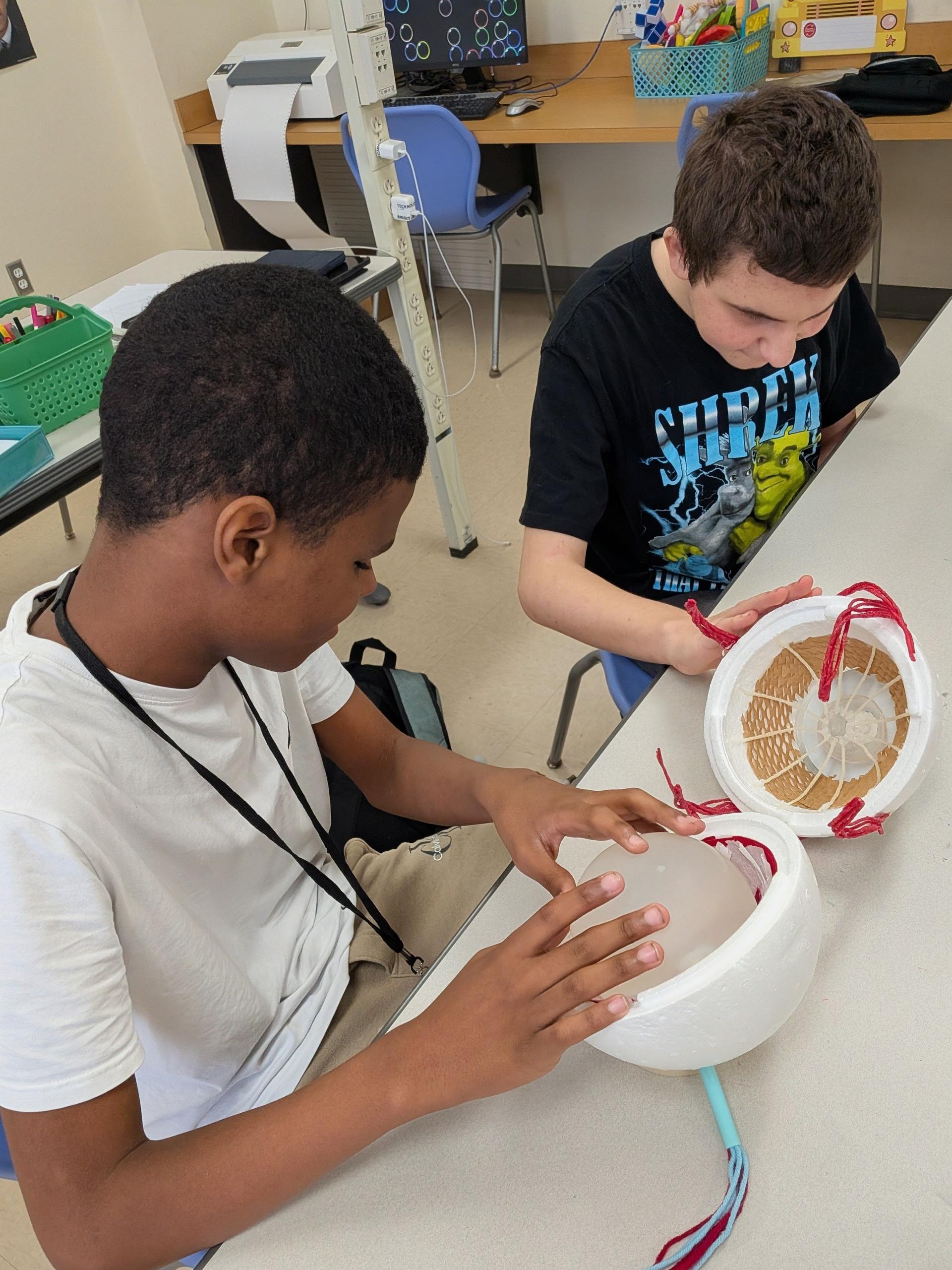 Juniell and Demitri explore the inside of the model