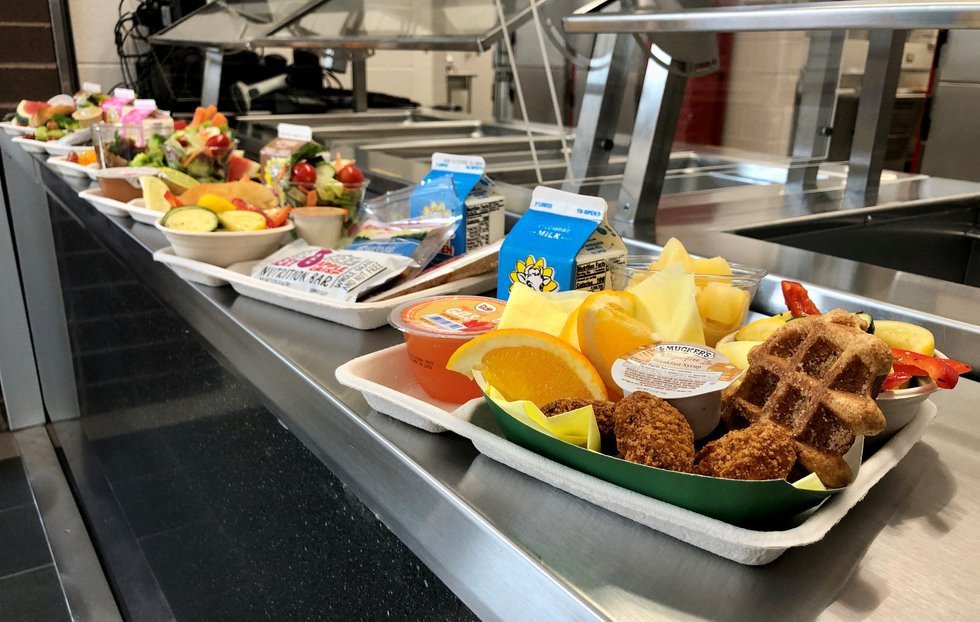 School lunches displayed on a cafeteria counter