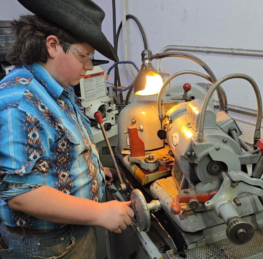 A student works on a machine.