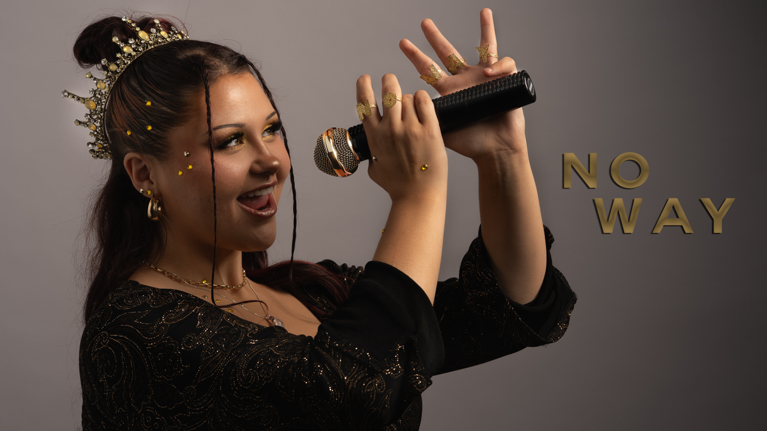 A student sings into a microphone. On the picture are the words 