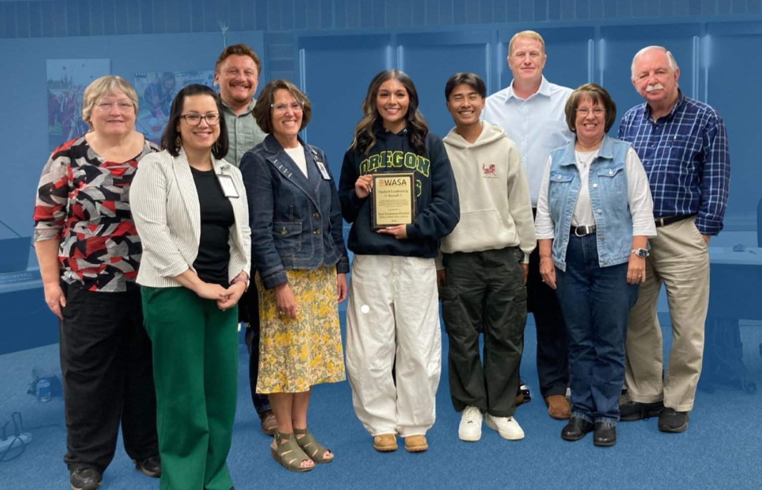 Itzel Contreras-Montiel with the board of directors and district leaders