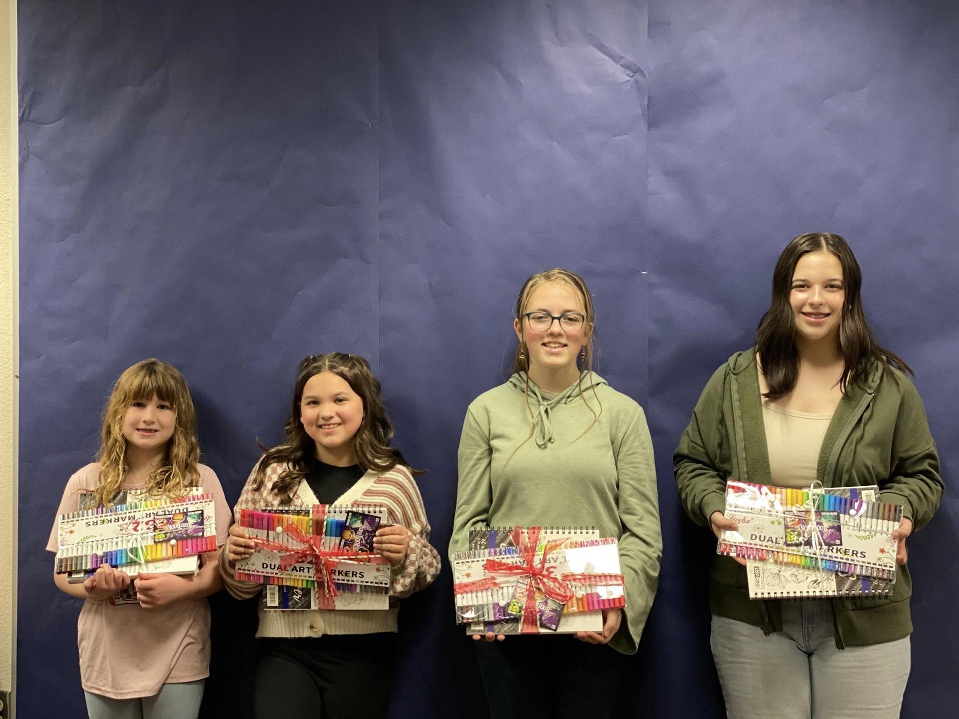 River HomeLink students display the prizes they received for their artwork