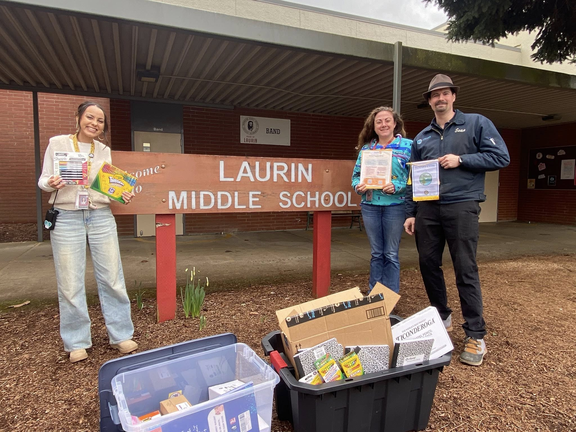 Battle Ground Rotarians display school supplies donated to Laurin Middle School