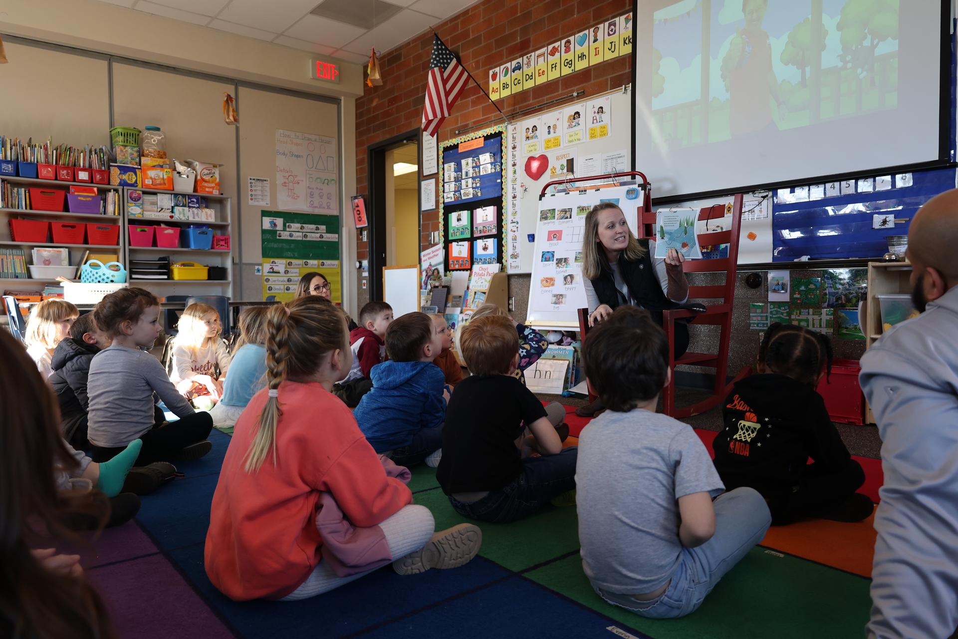 A teacher reads to a Transitional Kindergarten class