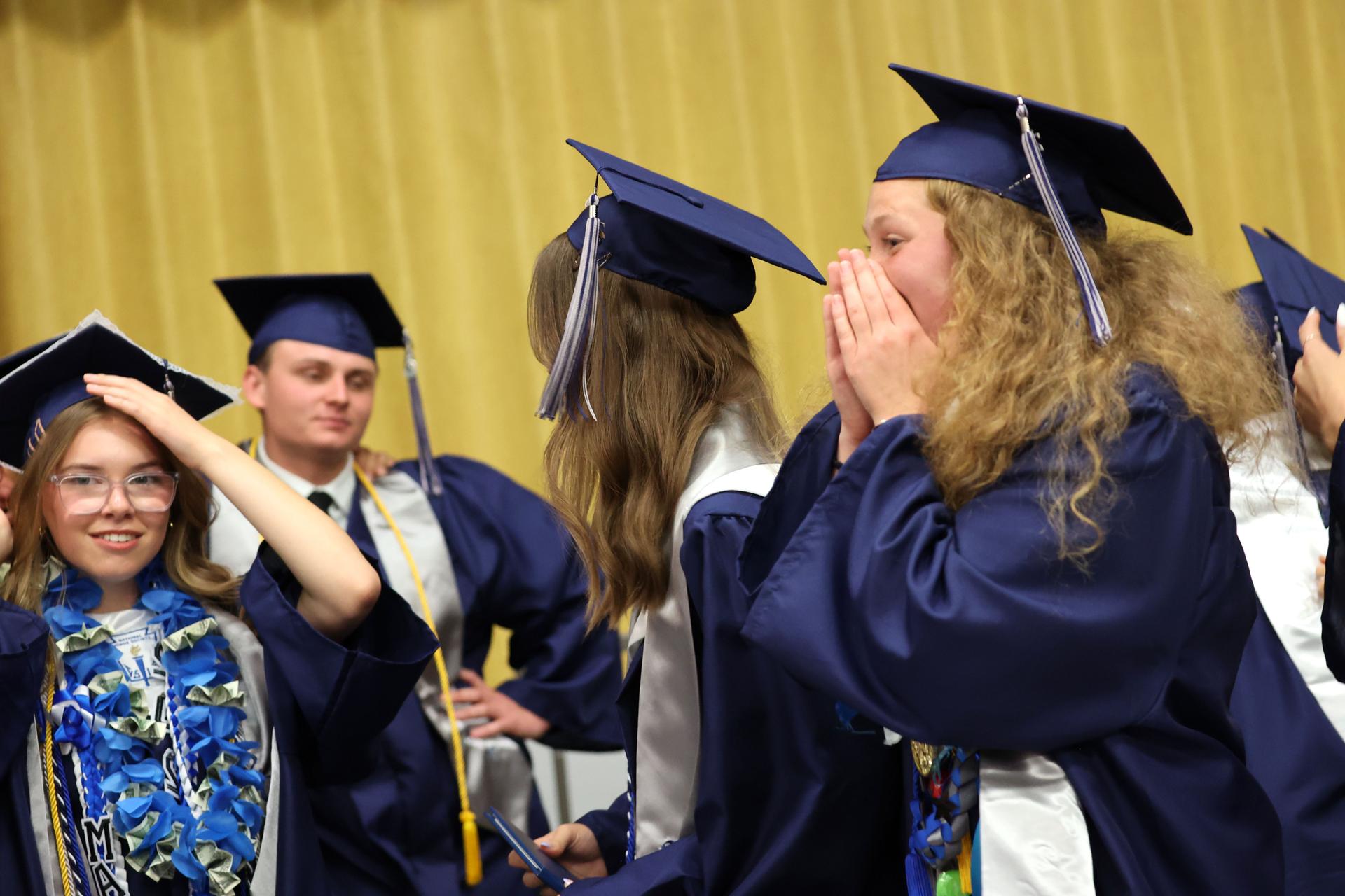 CAM Academy graduates react excitedly to their commencement