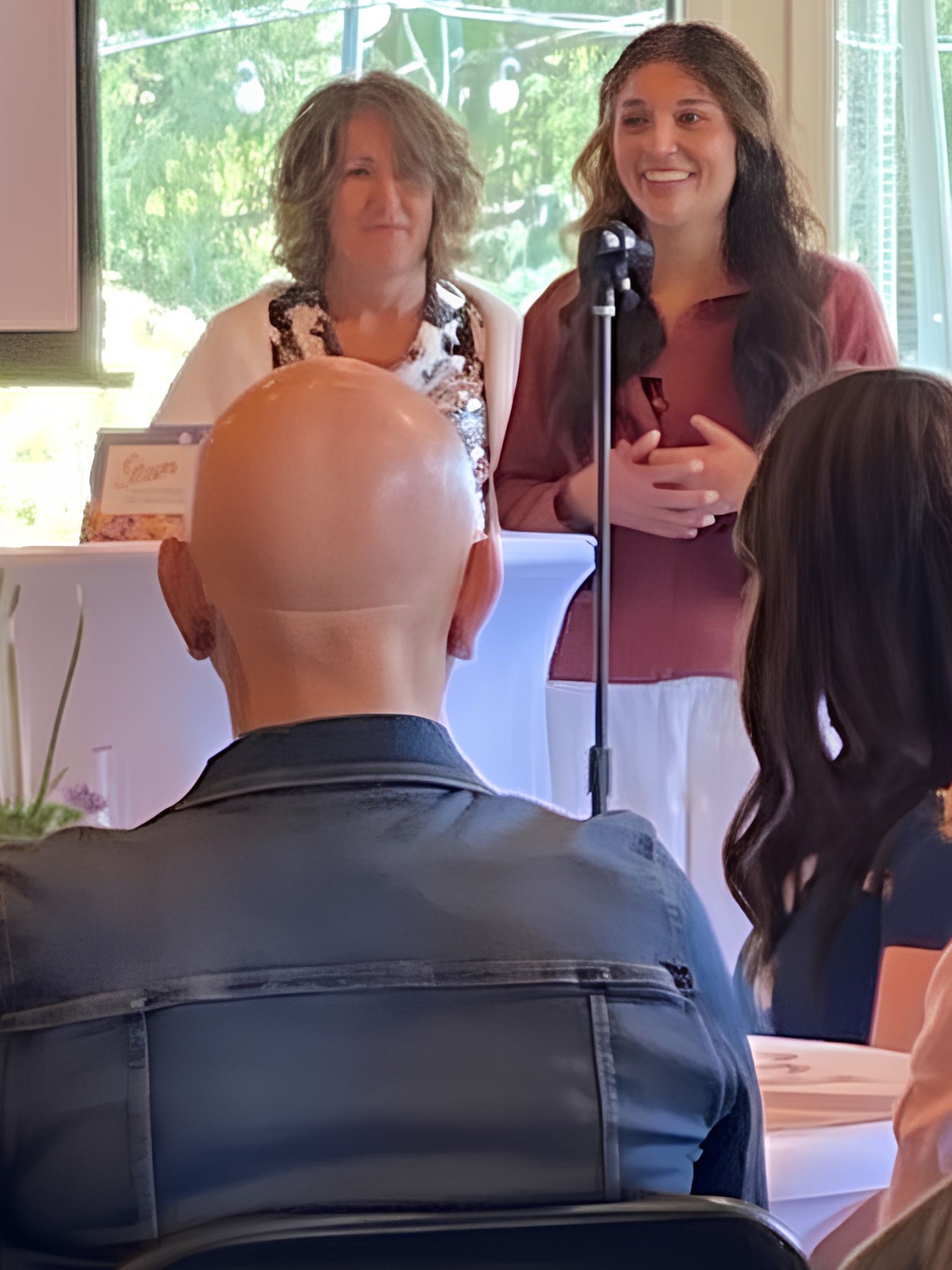 Superintendent Shelly Whitten and Student Board Rep Itzel Contreras Montiel speak at the spring soiree