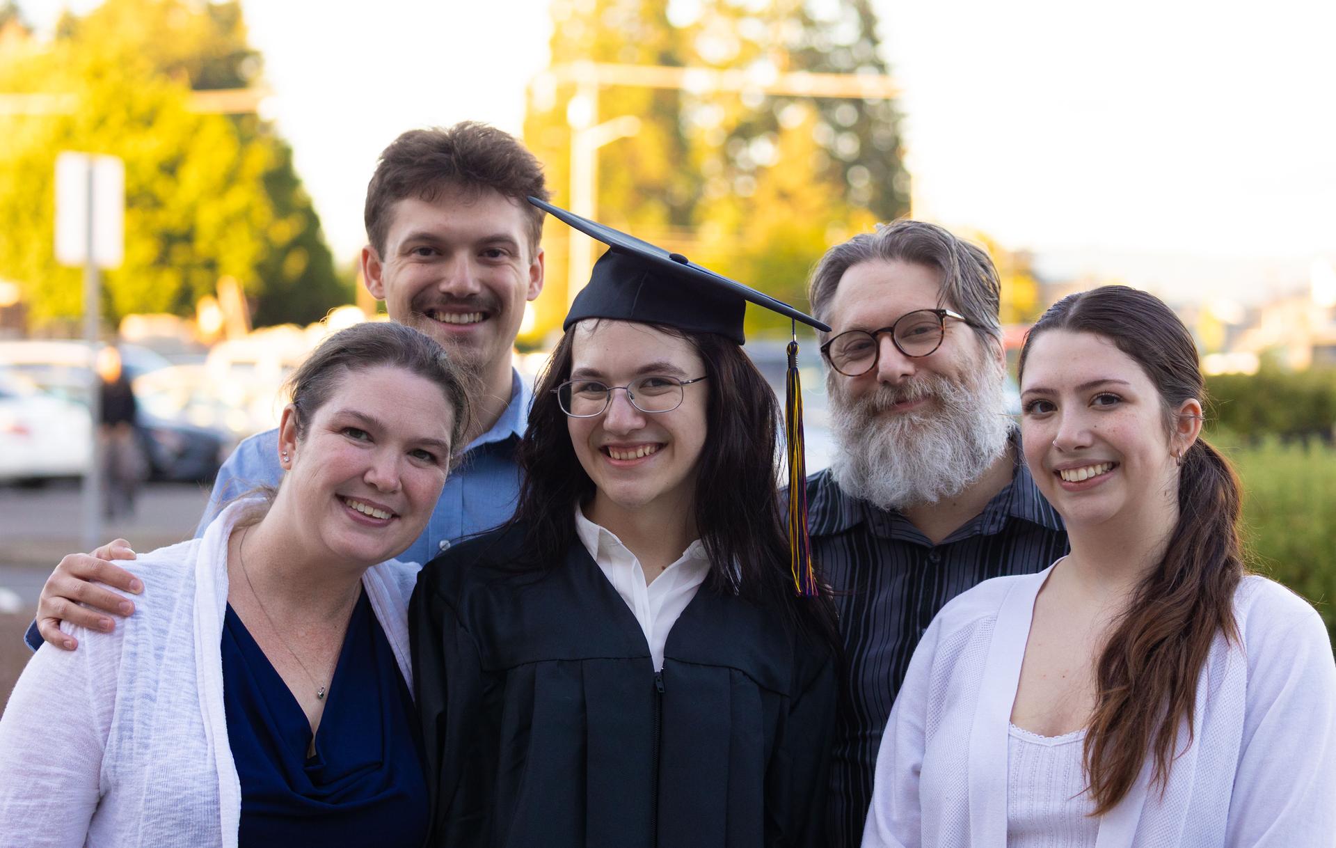 A BGVA graduate and family poses for a photo.