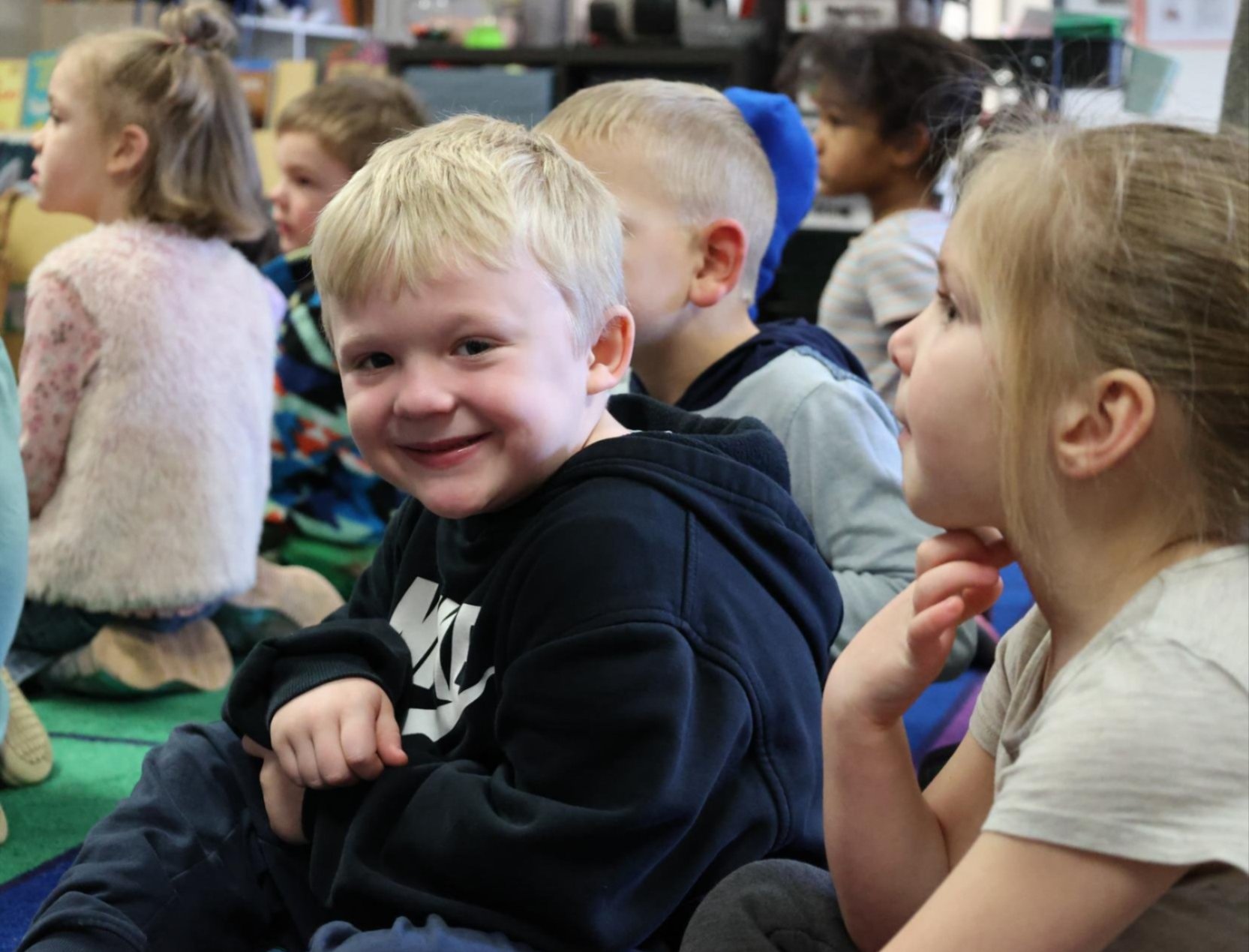 A student smiles at the camera