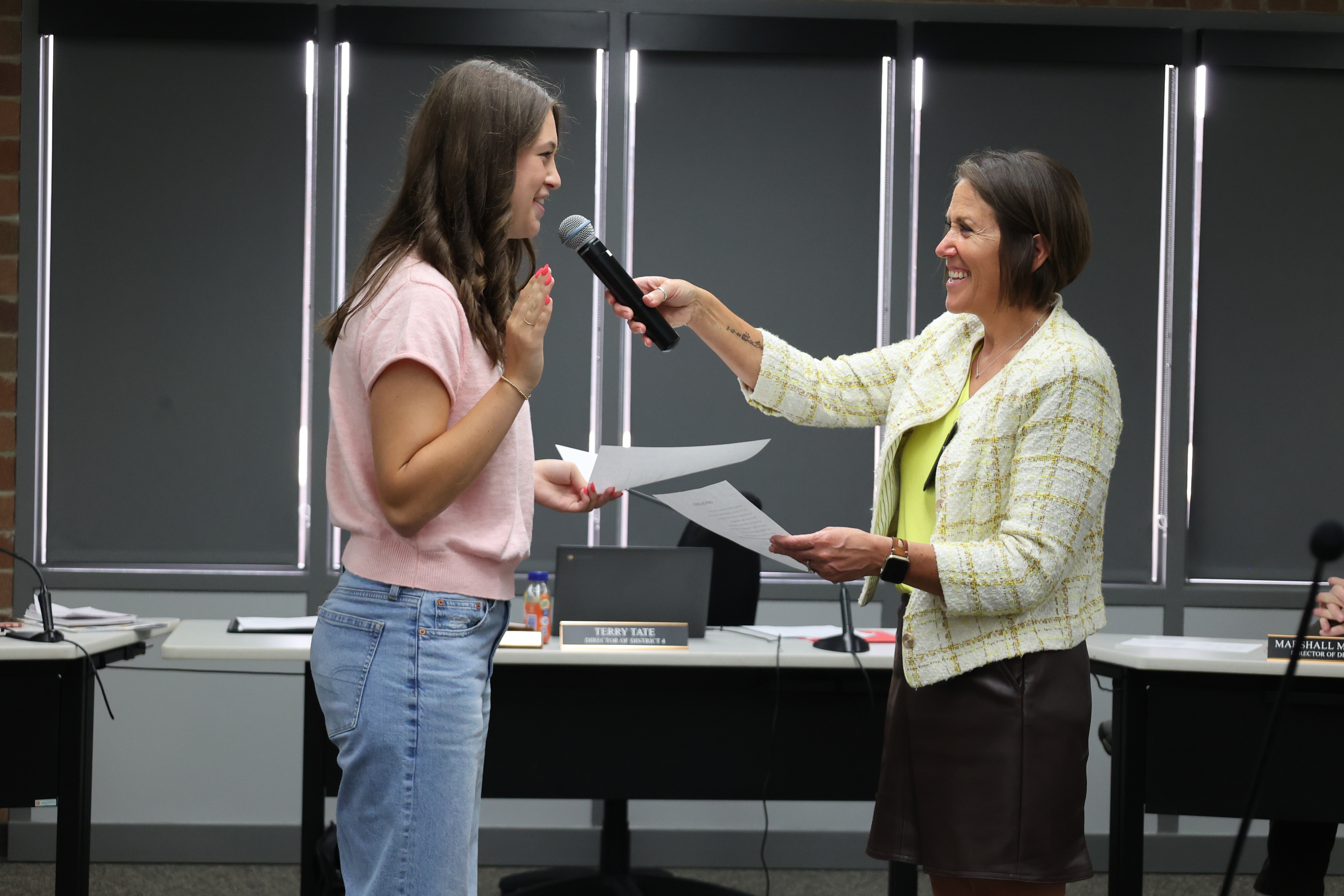 Addison Juhnke takes the oath of office to join the district's board of directors