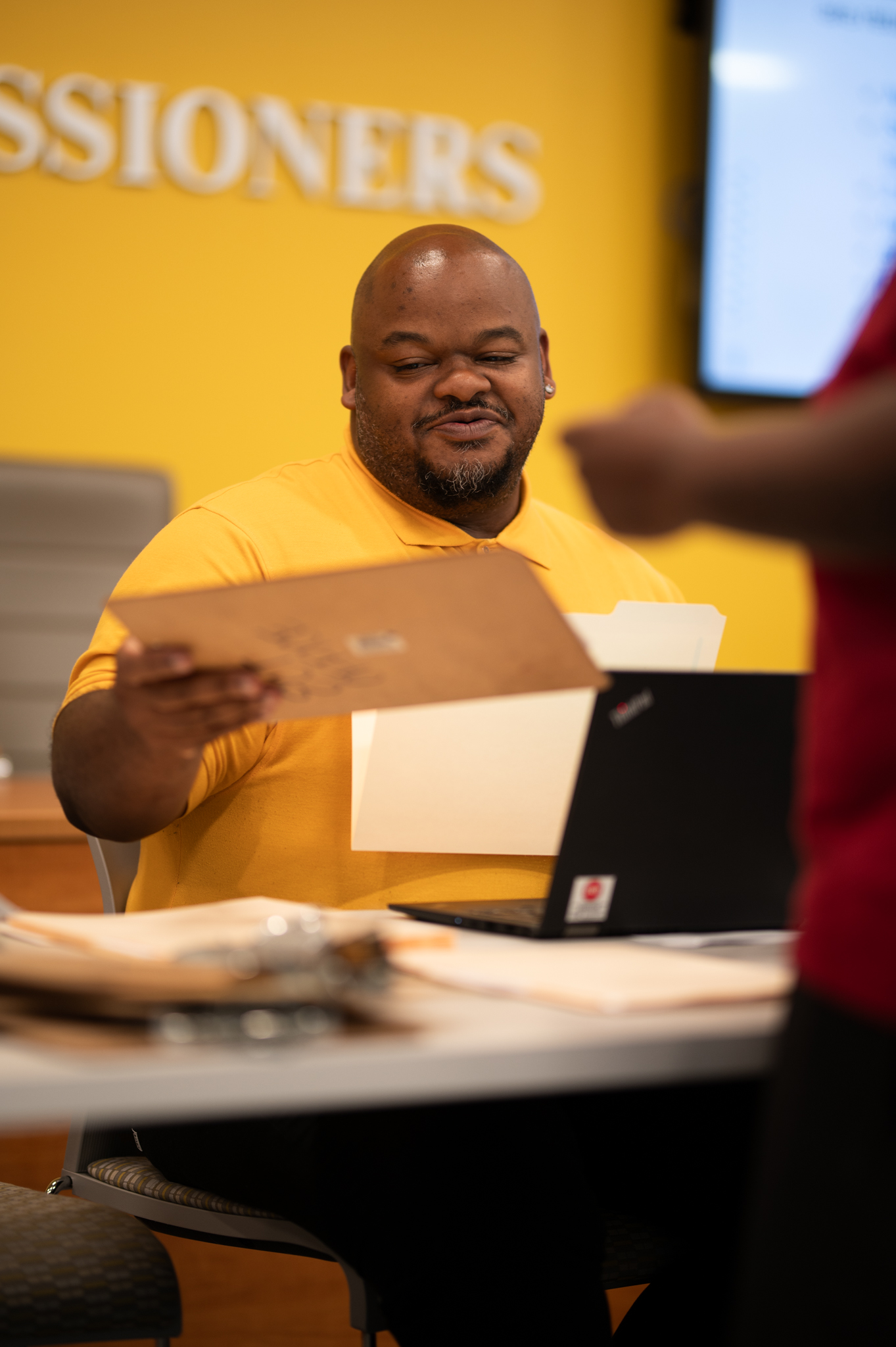 Staff member behind desk