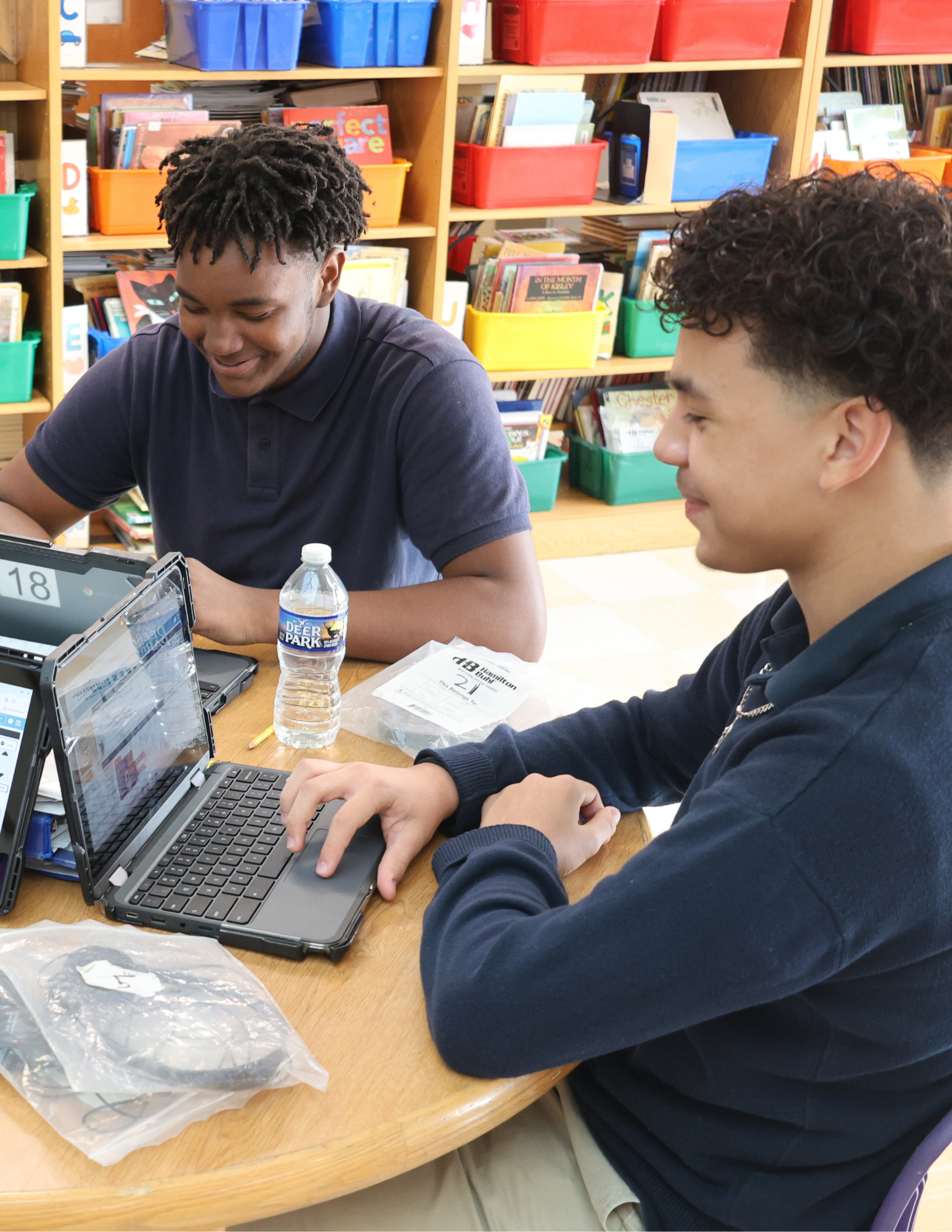 Violetville Elementary/Middle School students using devices in the library