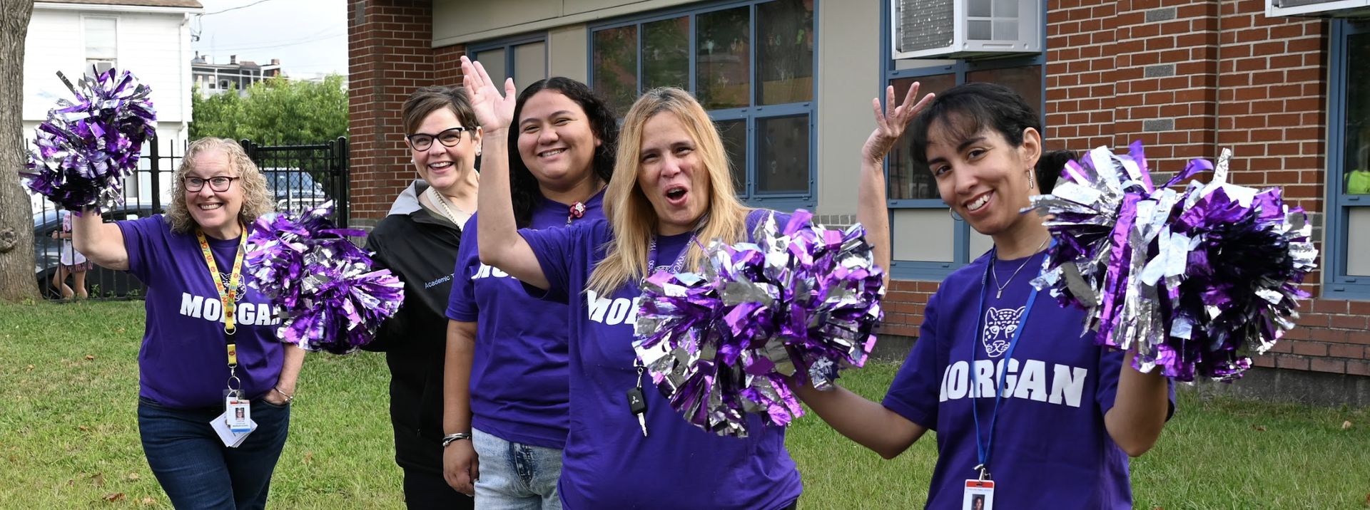 A student and teacher look at a combination lock