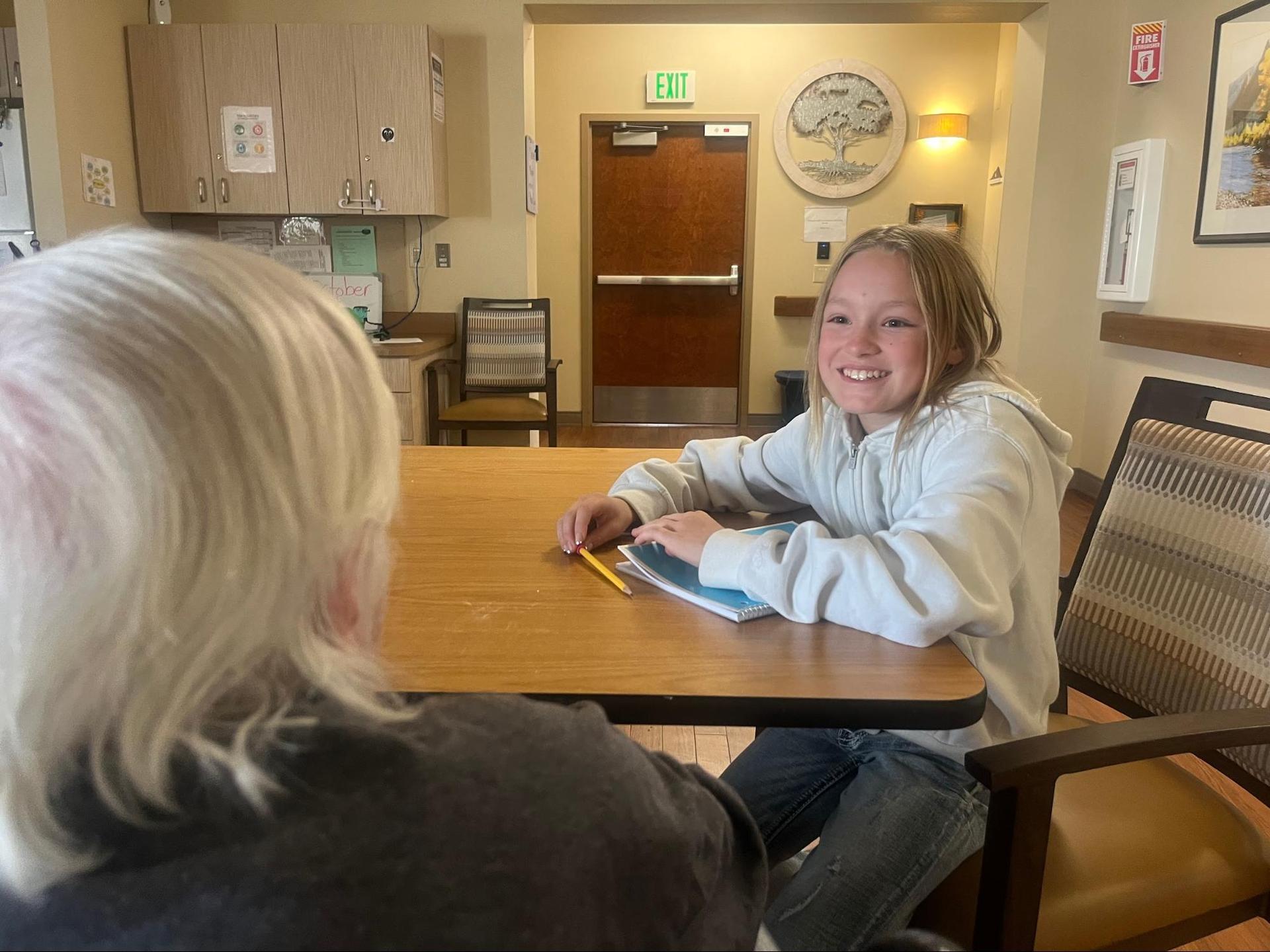 6th graders interviewing residents at the Wallowa Valley Senior Living Center
