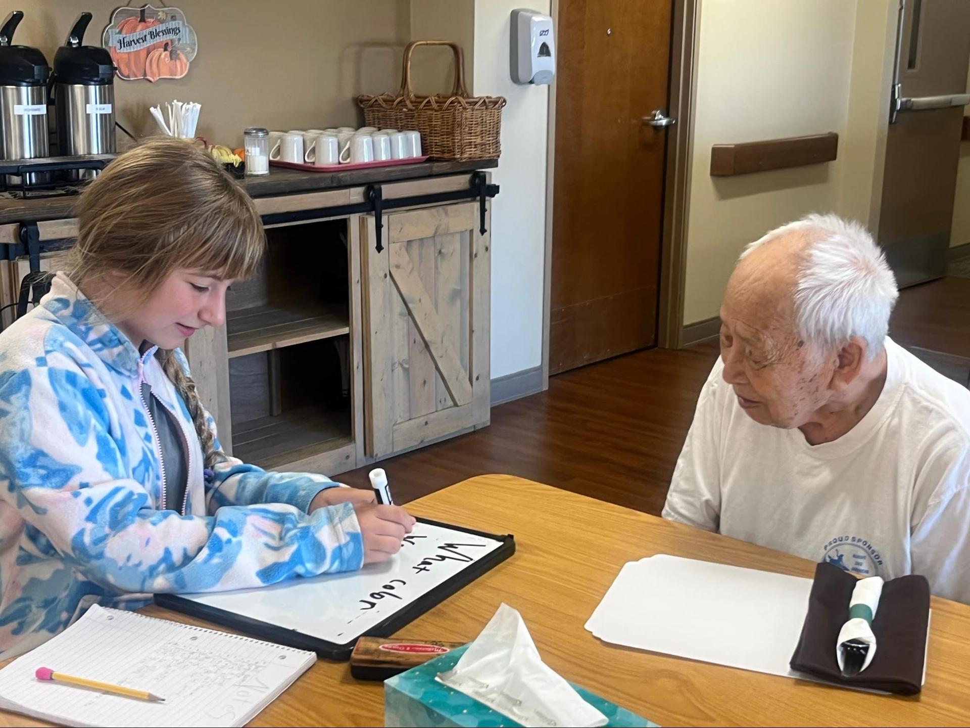 6th graders interviewing residents at the Wallowa Valley Senior Living Center