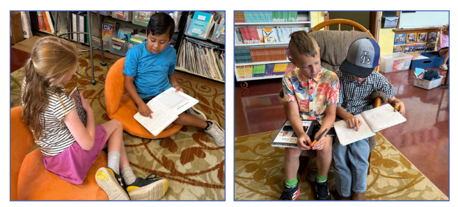 3rd graders reading letters from pen pals