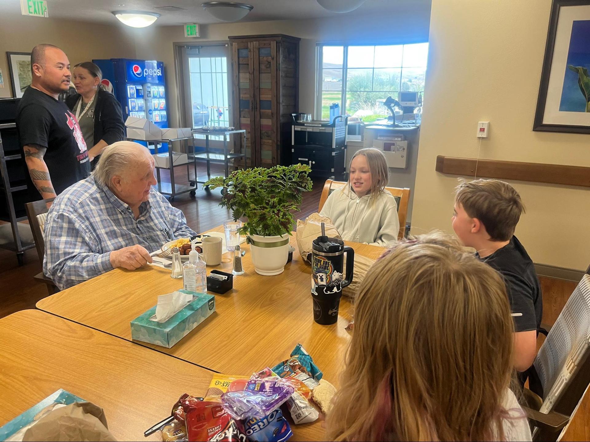 6th graders interviewing residents at the Wallowa Valley Senior Living Center