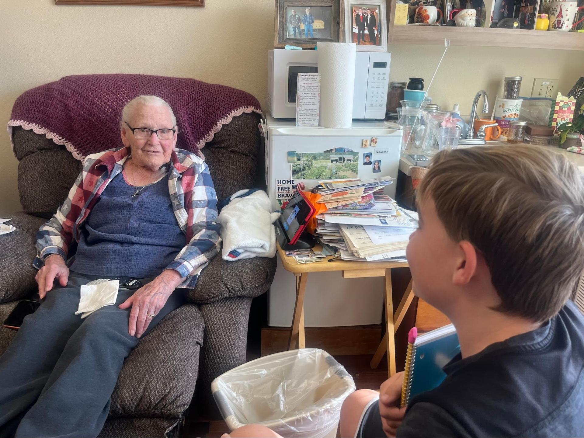 6th graders interviewing residents at the Wallowa Valley Senior Living Center