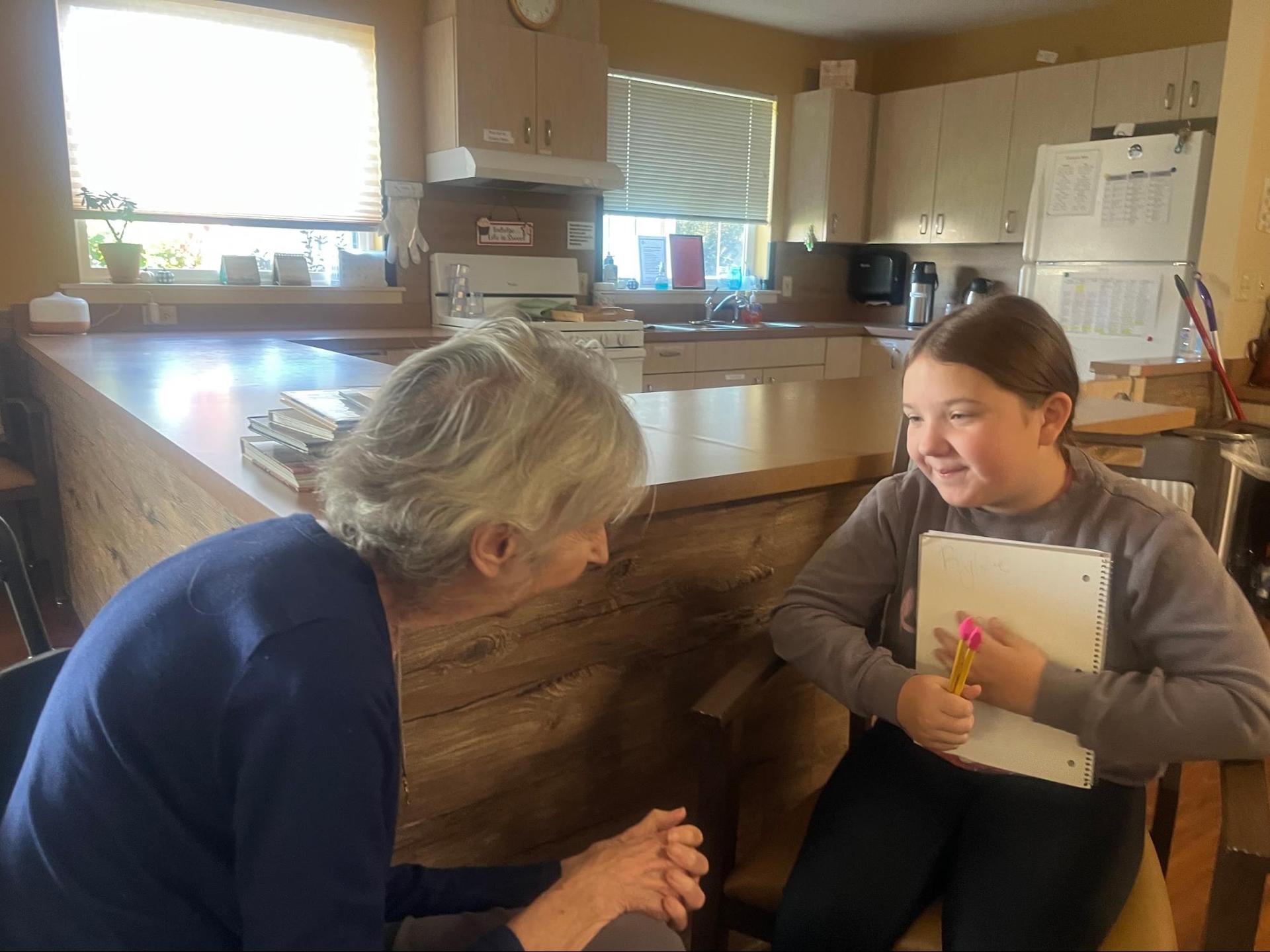 6th graders interviewing residents at the Wallowa Valley Senior Living Center