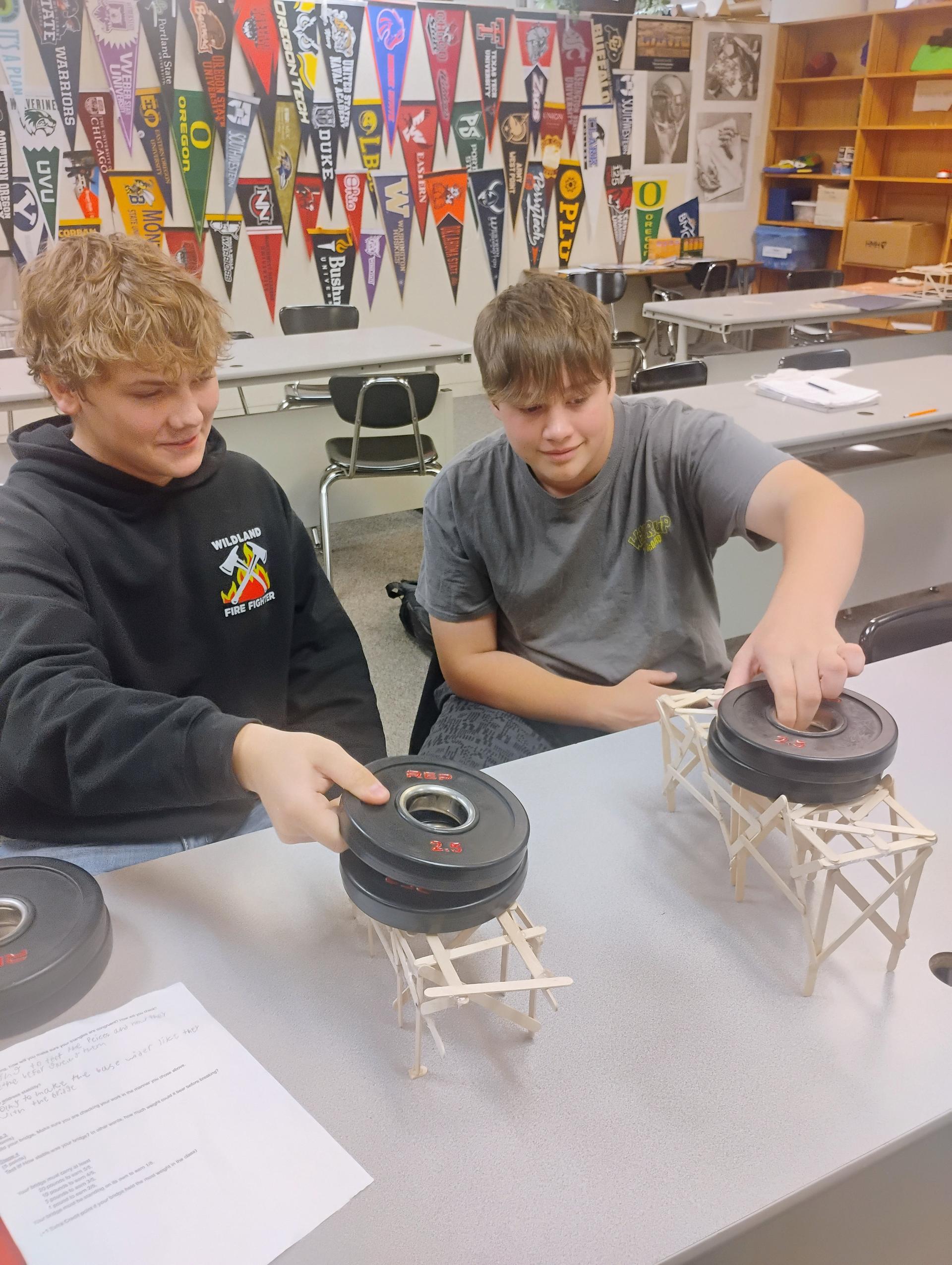 Geometry students testing their bridges