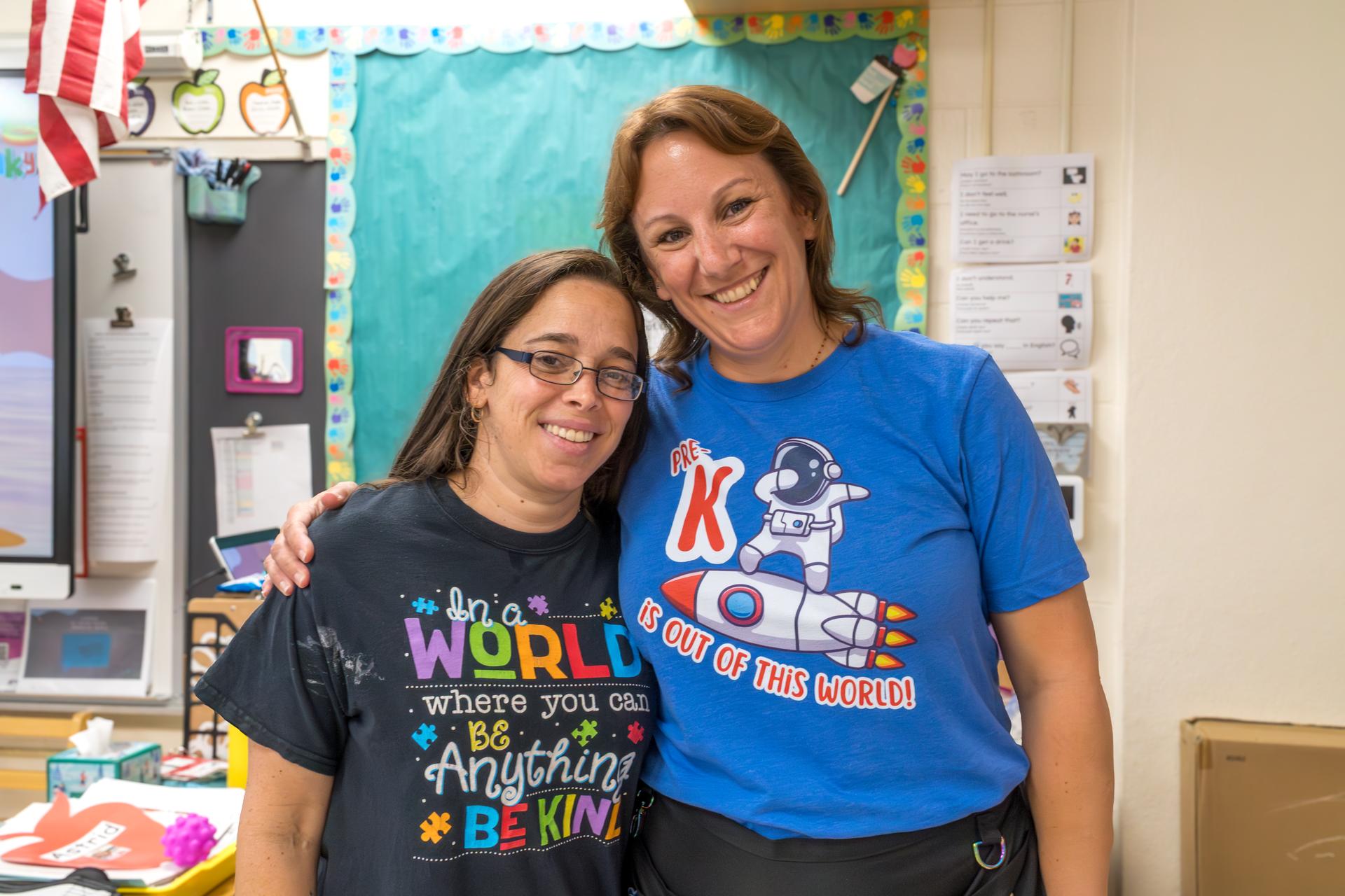 Two ECC preschool teachers pose for a photo.