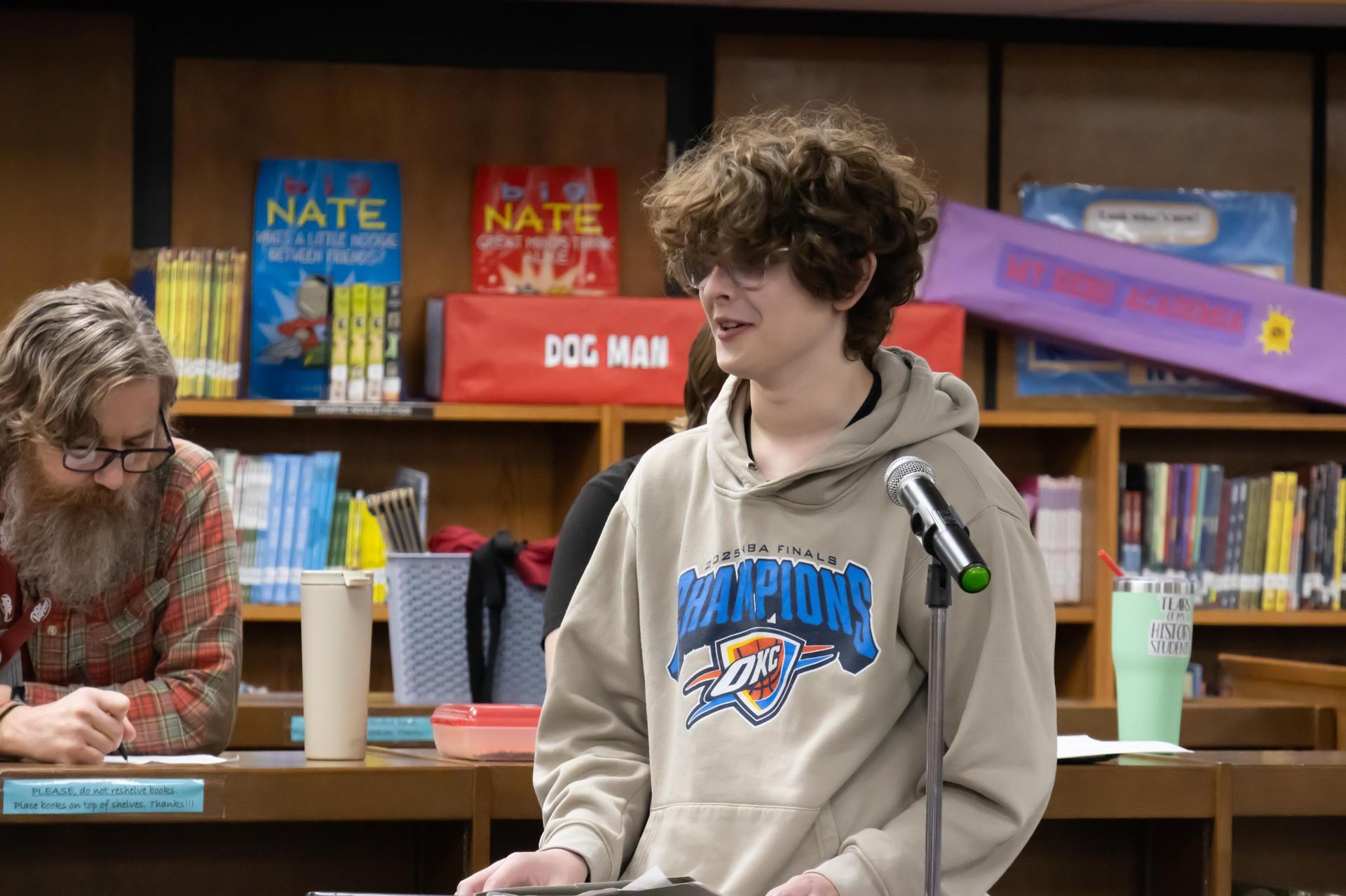 male student at podium 