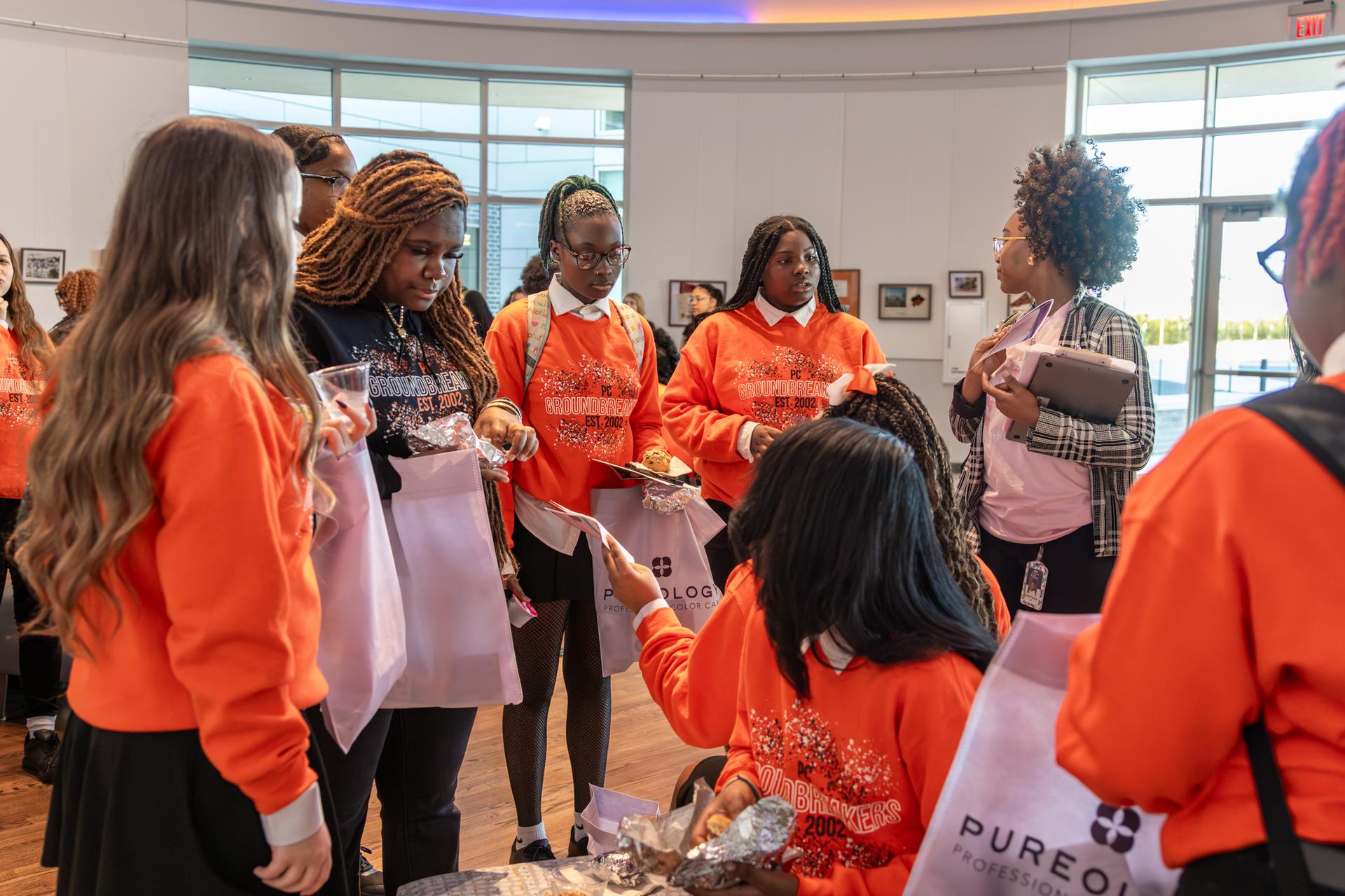 students receiving free items from sponsors