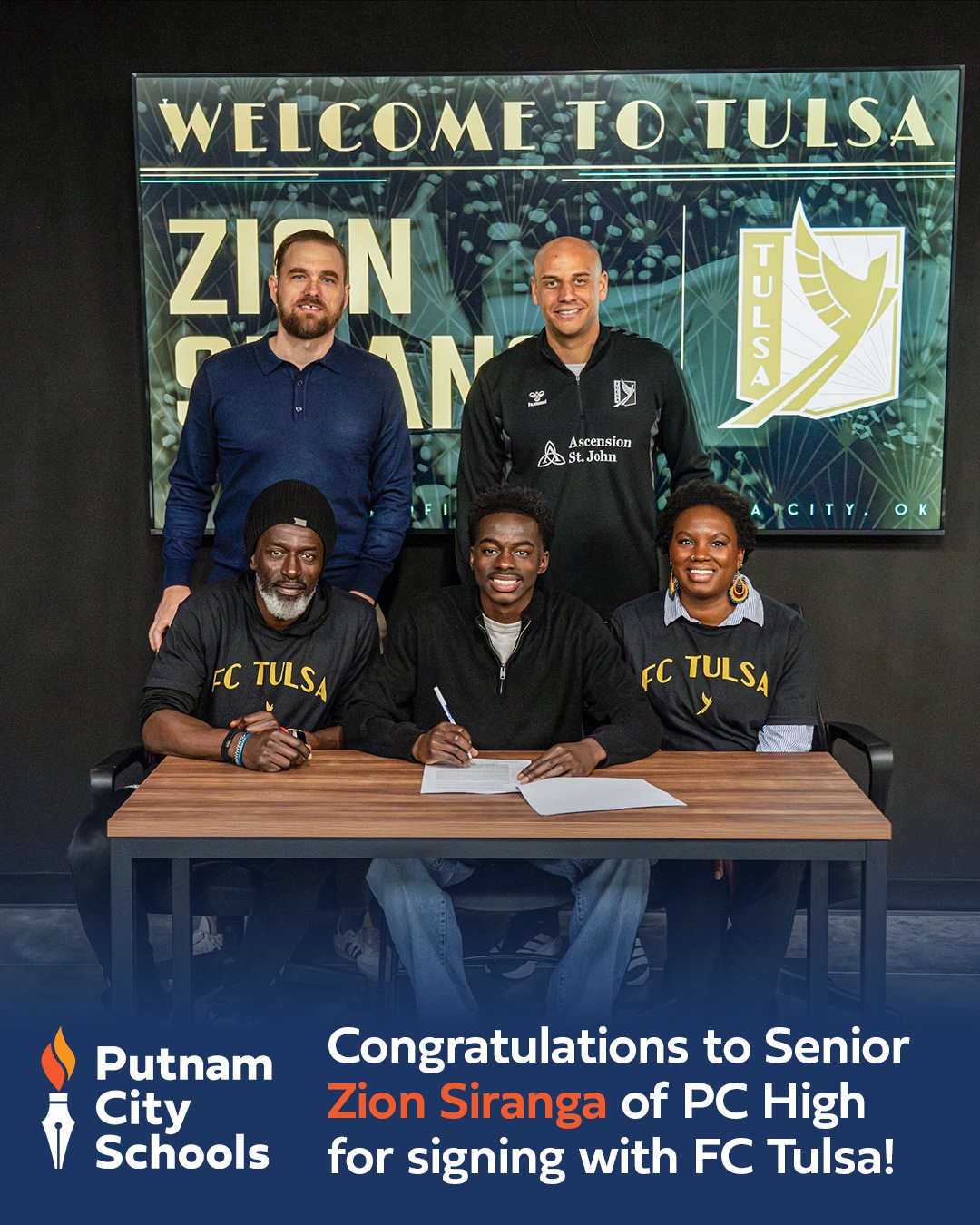 zion signing for FC tulsa with parents and coaches