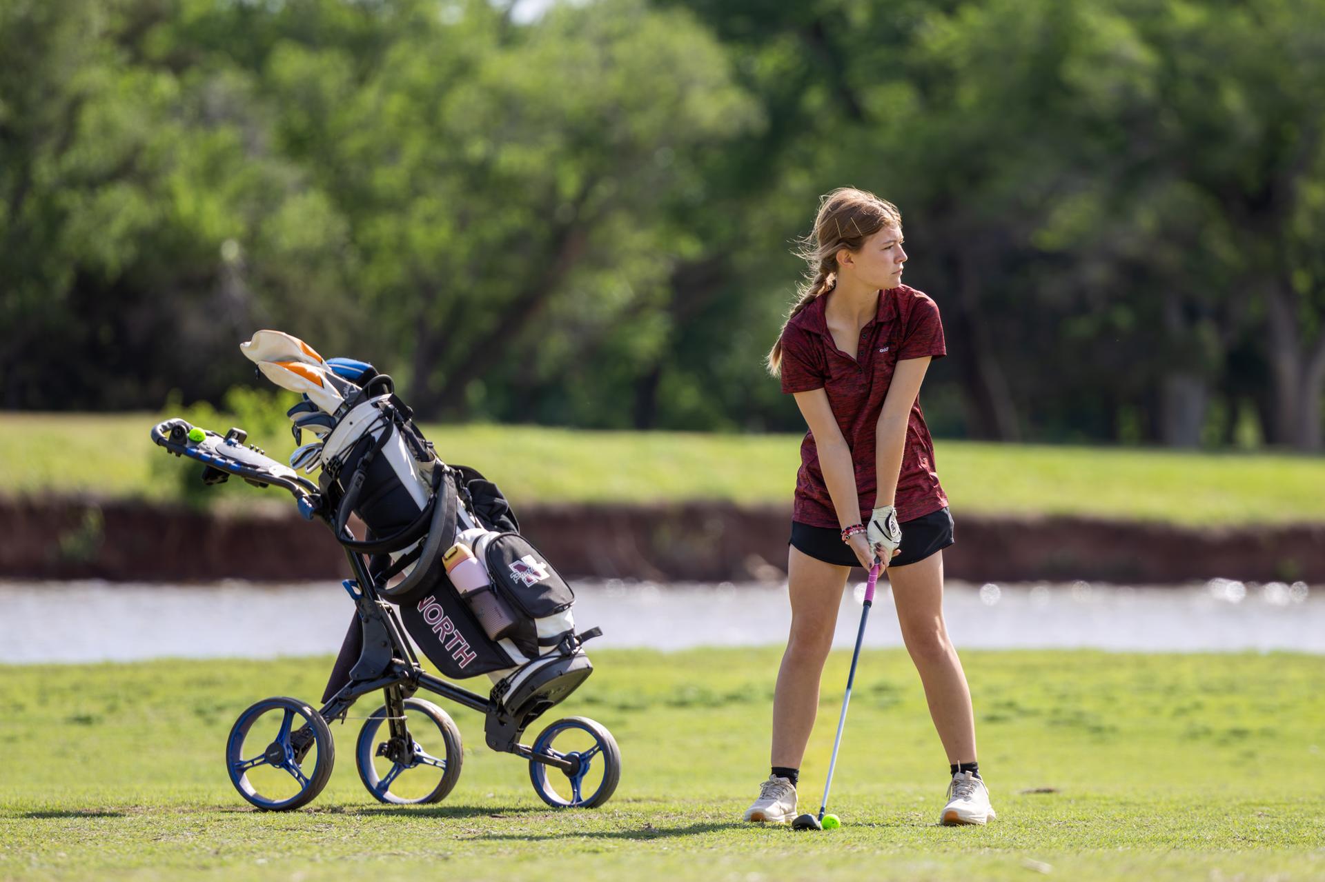 female athlete holding the golf puck 
