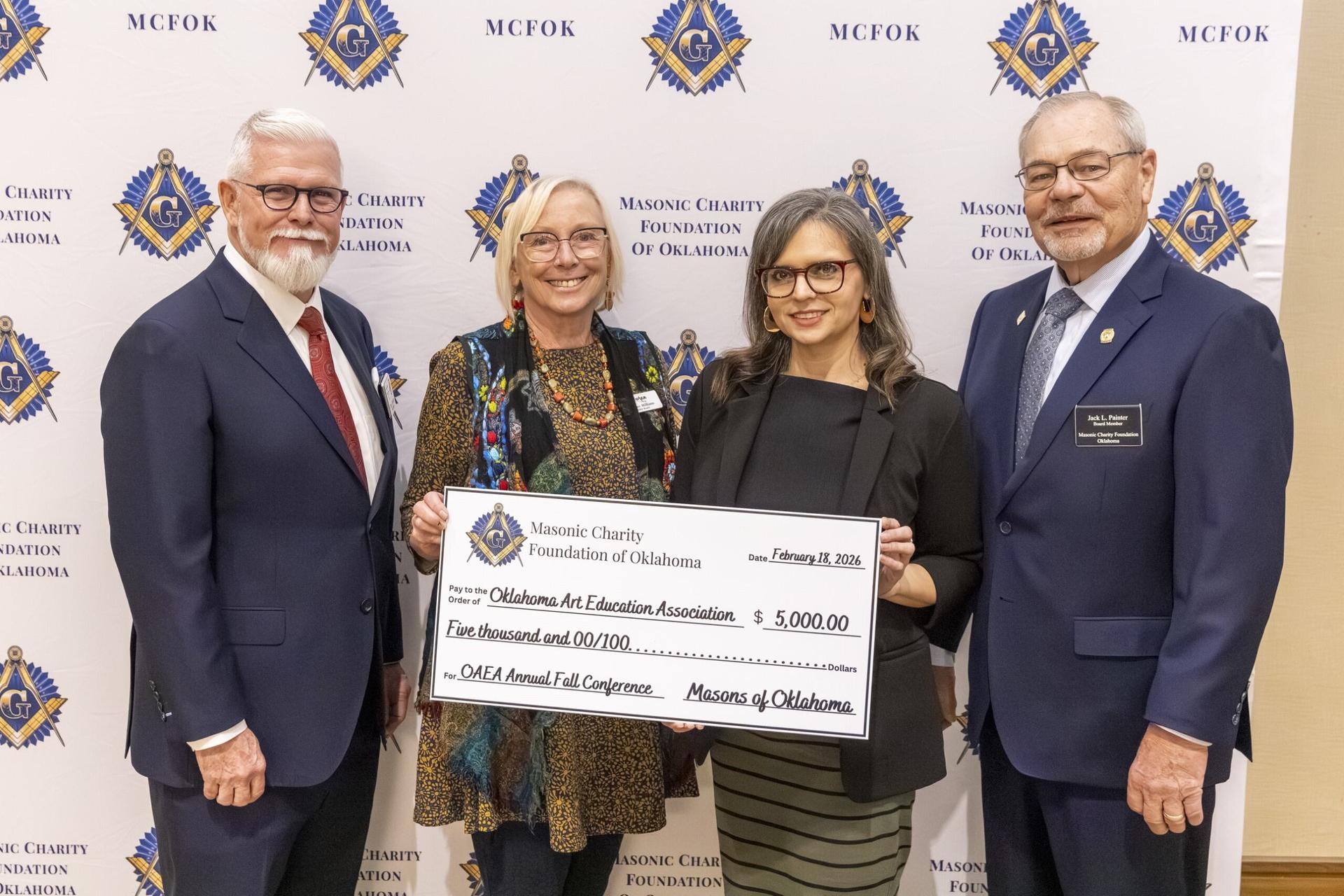 a check of 5,000 being presented to Oklahoma art education association