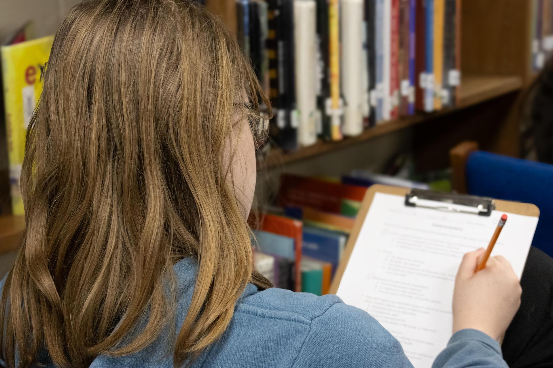 student taking notes