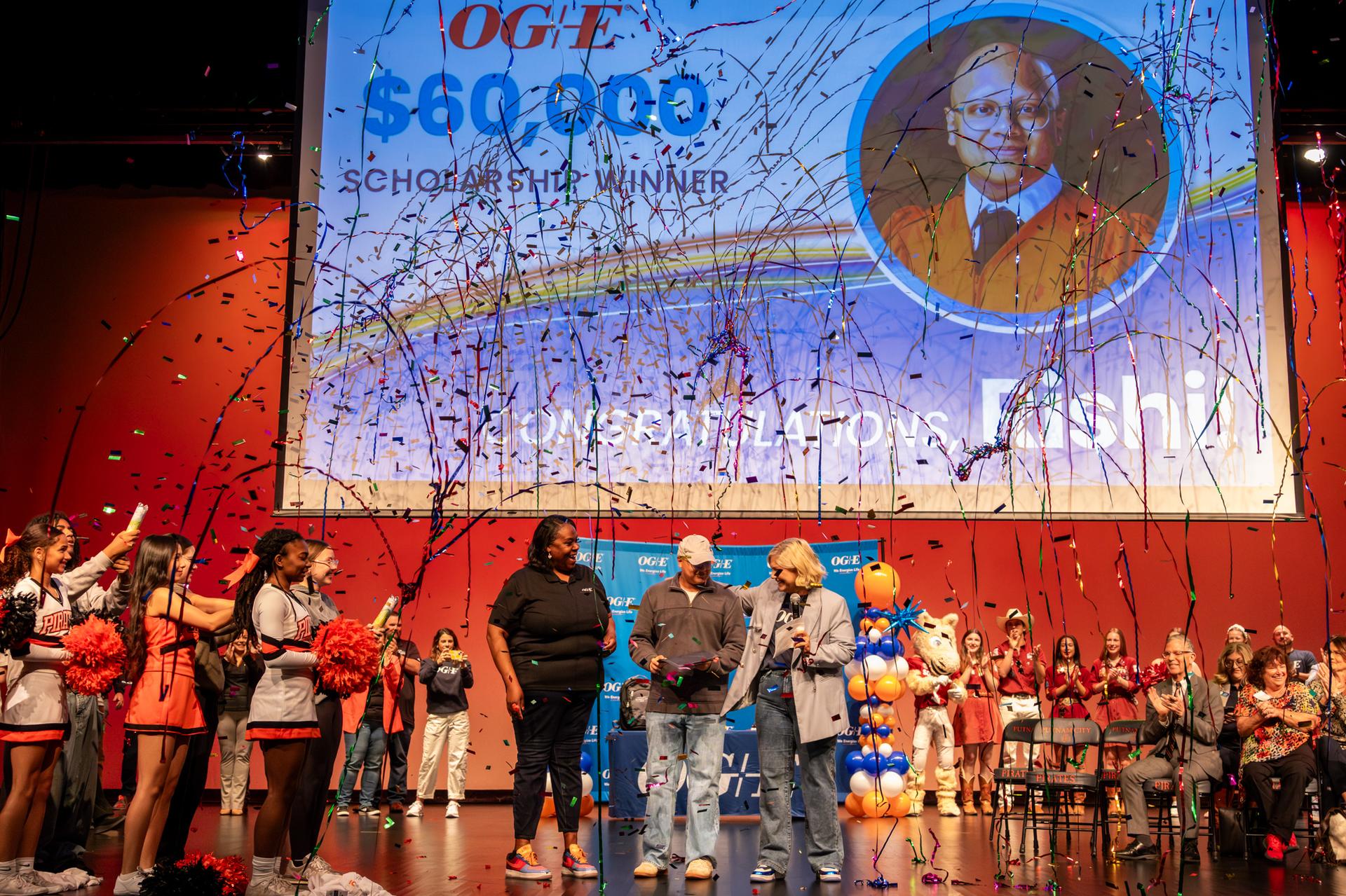 picture of student receiving award with confetti in the air