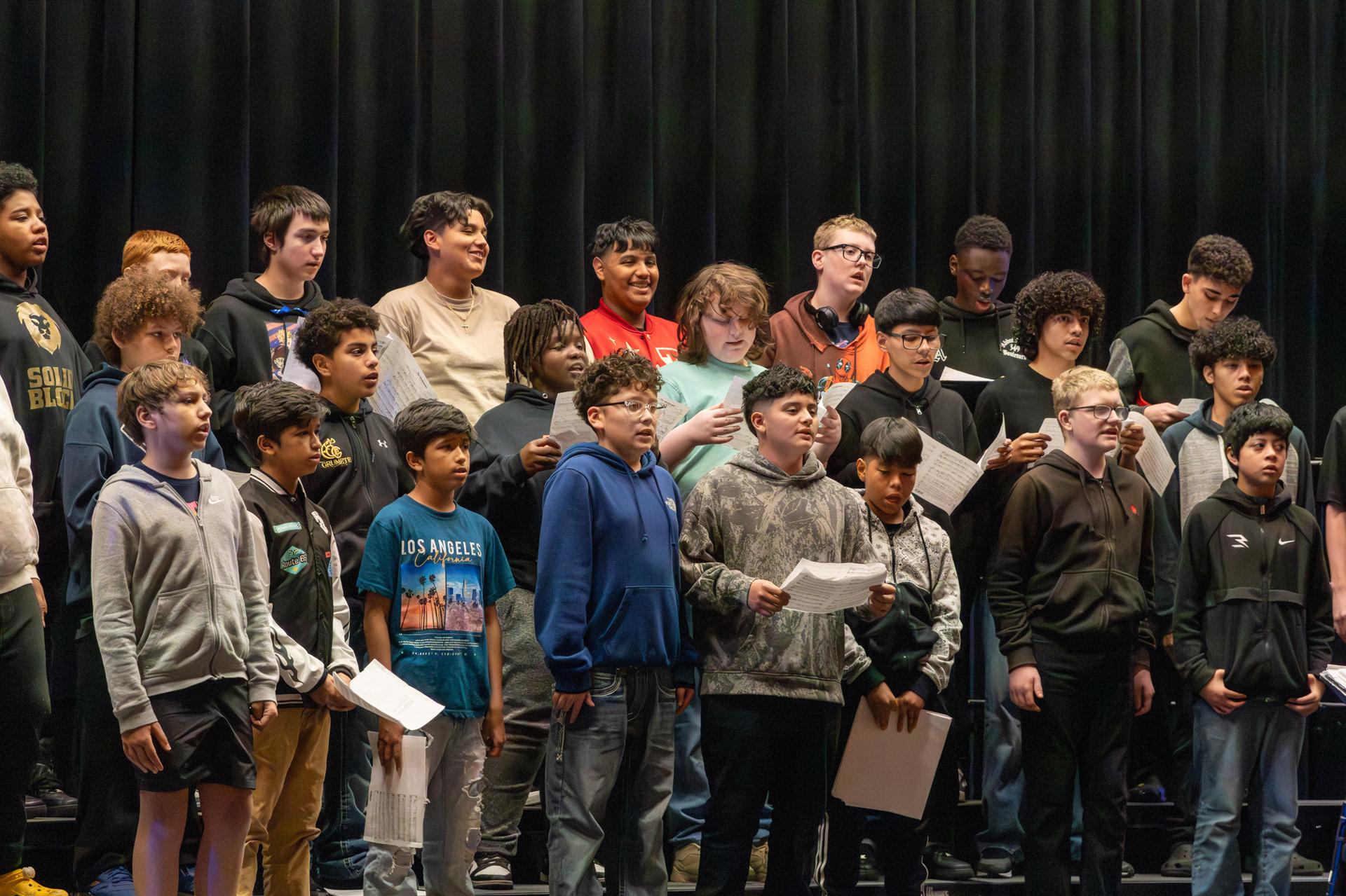 close shot of male students singing