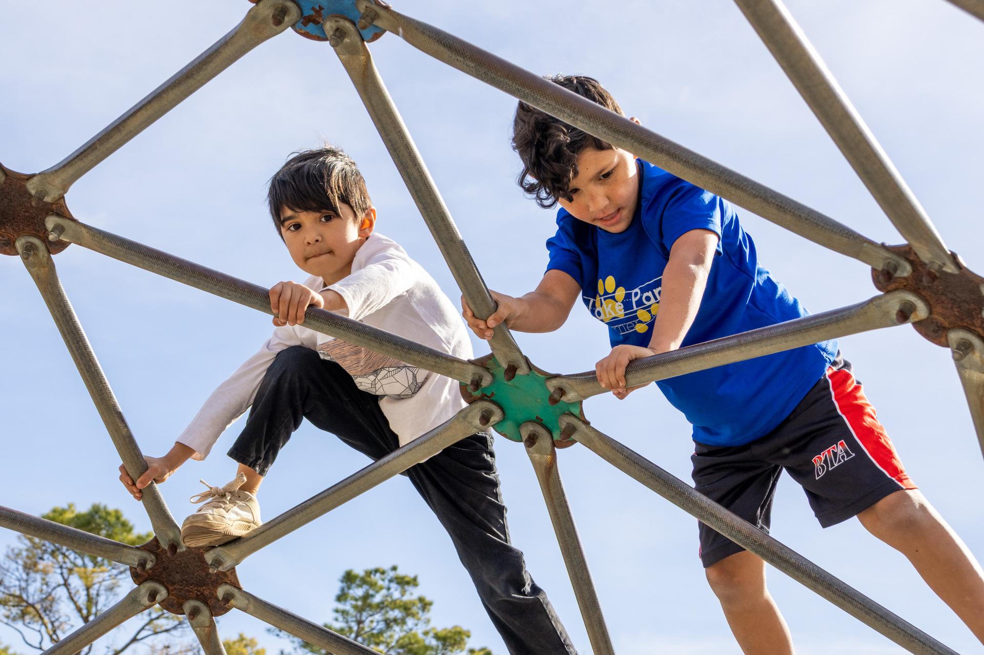 2 lake park kids on a jungle gym