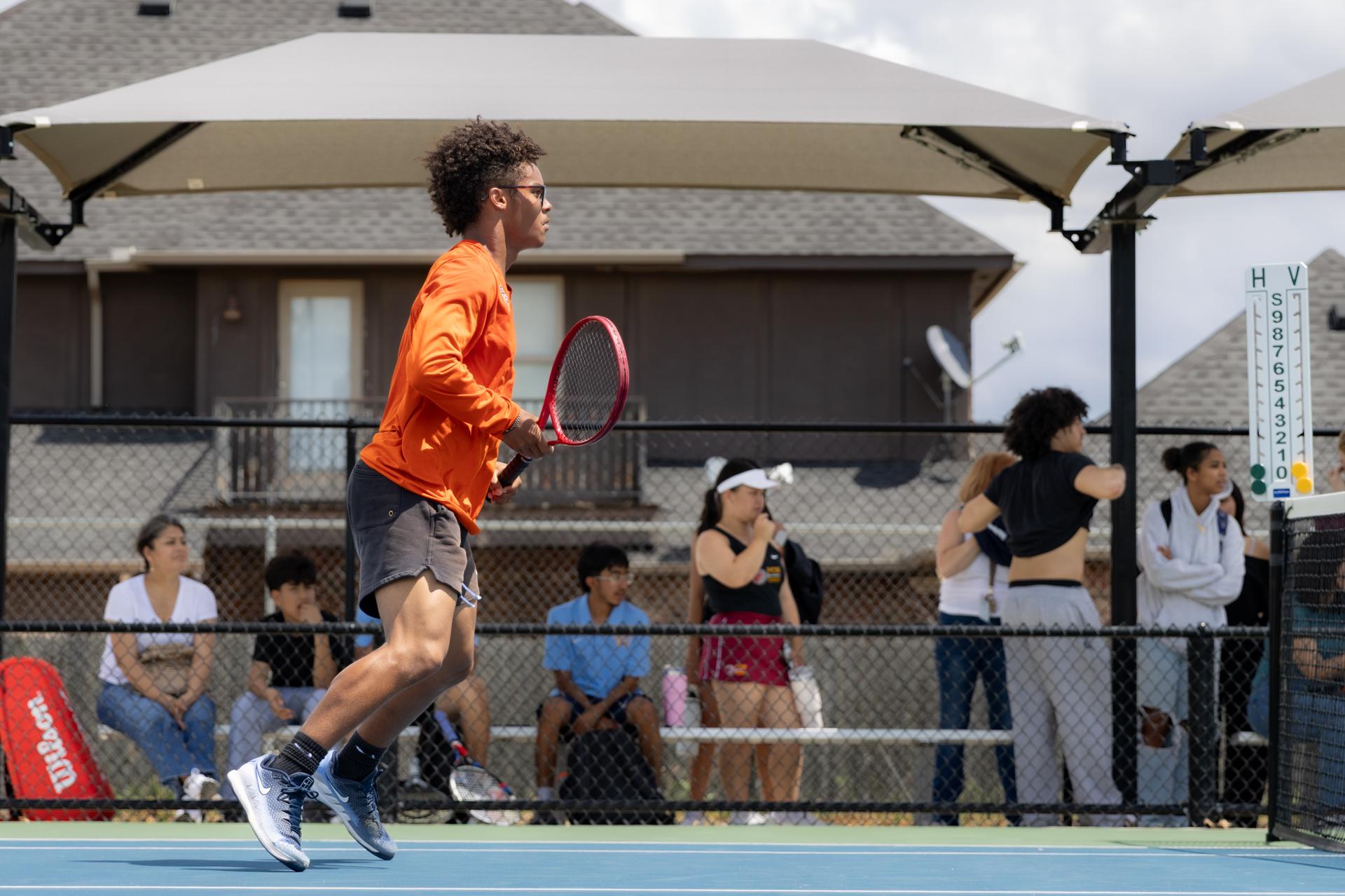 pch athlete with tennis racket in hand