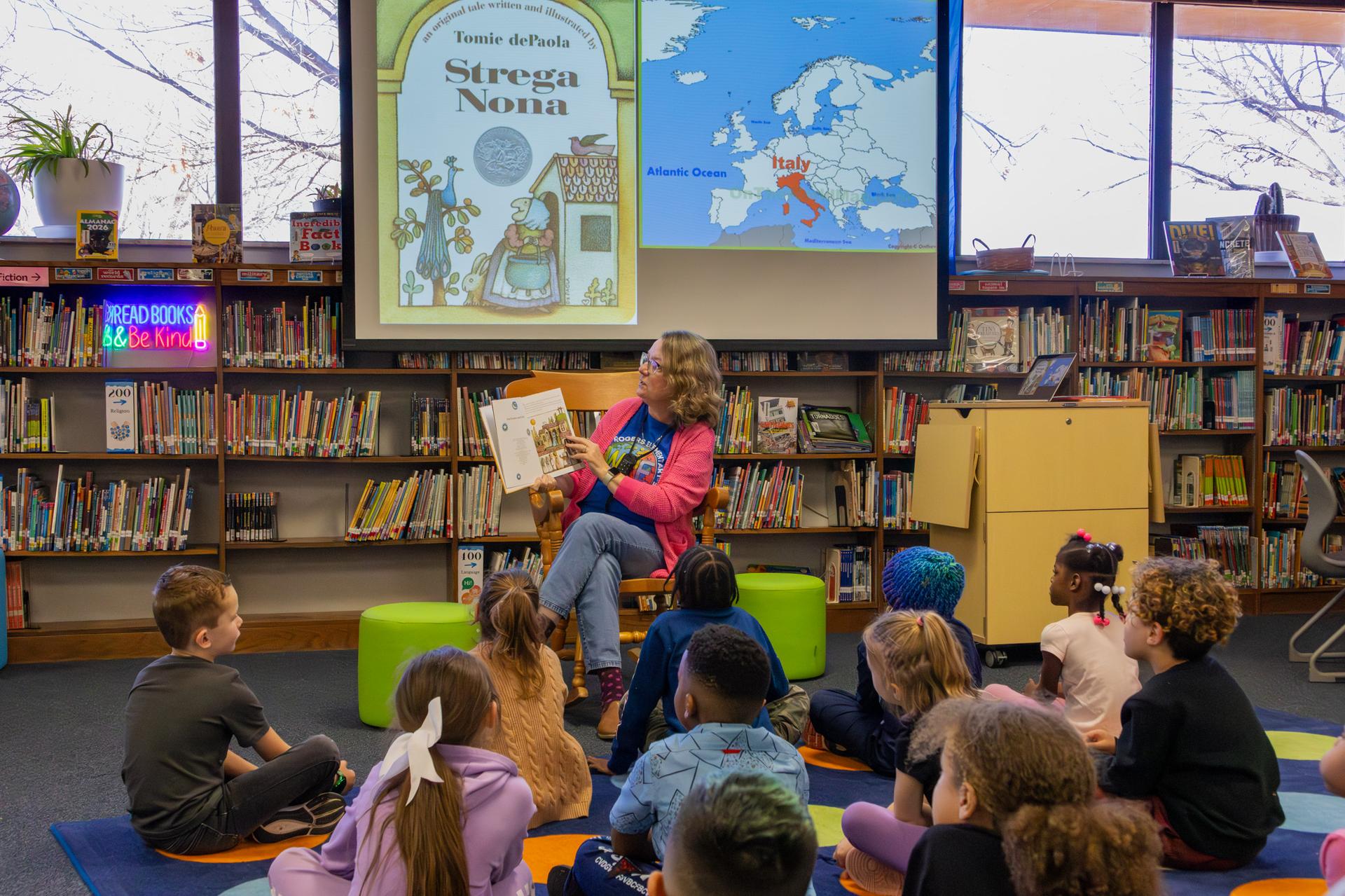 kids engaged with the book being read aloud